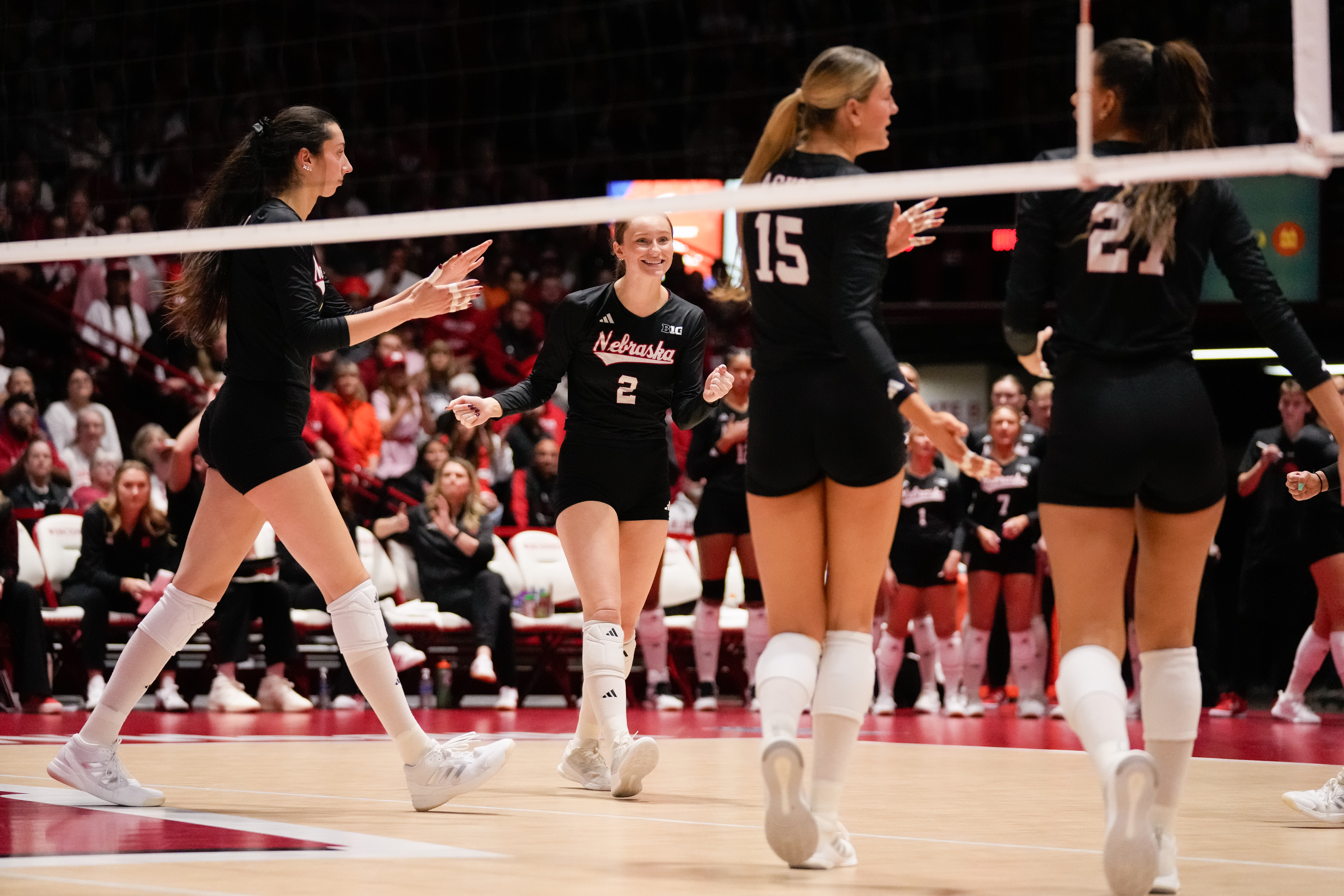 MADISON, WISCONSIN - OCTOBER 31: Nebraska Cornhuskers teammates from left, Virginia Adriano #9, Bergen Reilly #2, Andi Jackson #15 and Harper Murray #27 reacts to scoring a point during the third set against the Wisconsin Badgers at Wisconsin Field House on October 31, 2025 in Madison, Wisconsin. (Photo by Kayla Wolf/Getty Images)