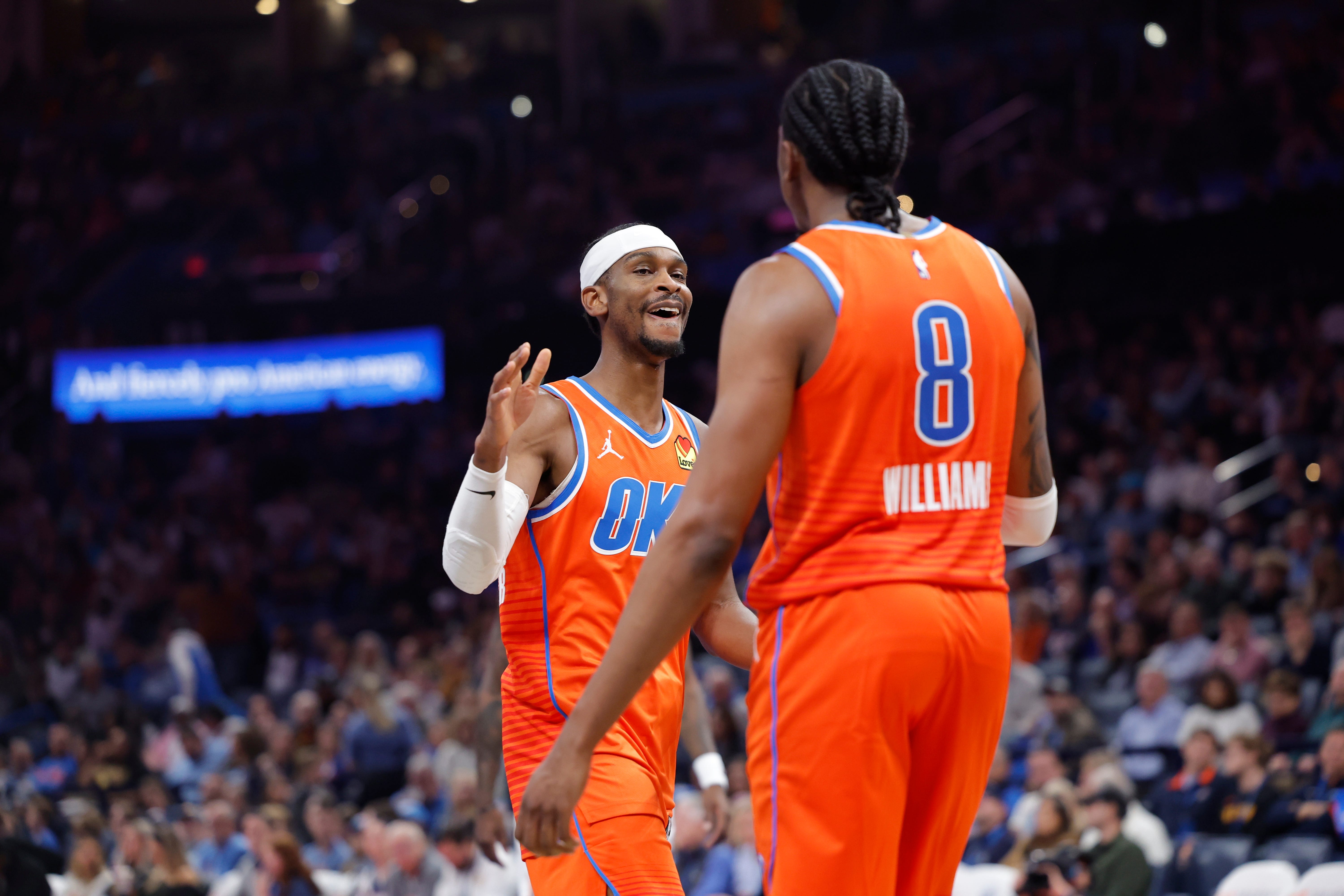 Nov 28, 2025; Oklahoma City, Oklahoma, USA; Oklahoma City Thunder guard Shai Gilgeous-Alexander (2) high fives guard Jalen Williams (8) after scoring against the Phoenix Suns during the second half at Paycom Center. Mandatory Credit: Alonzo Adams-Imagn Images