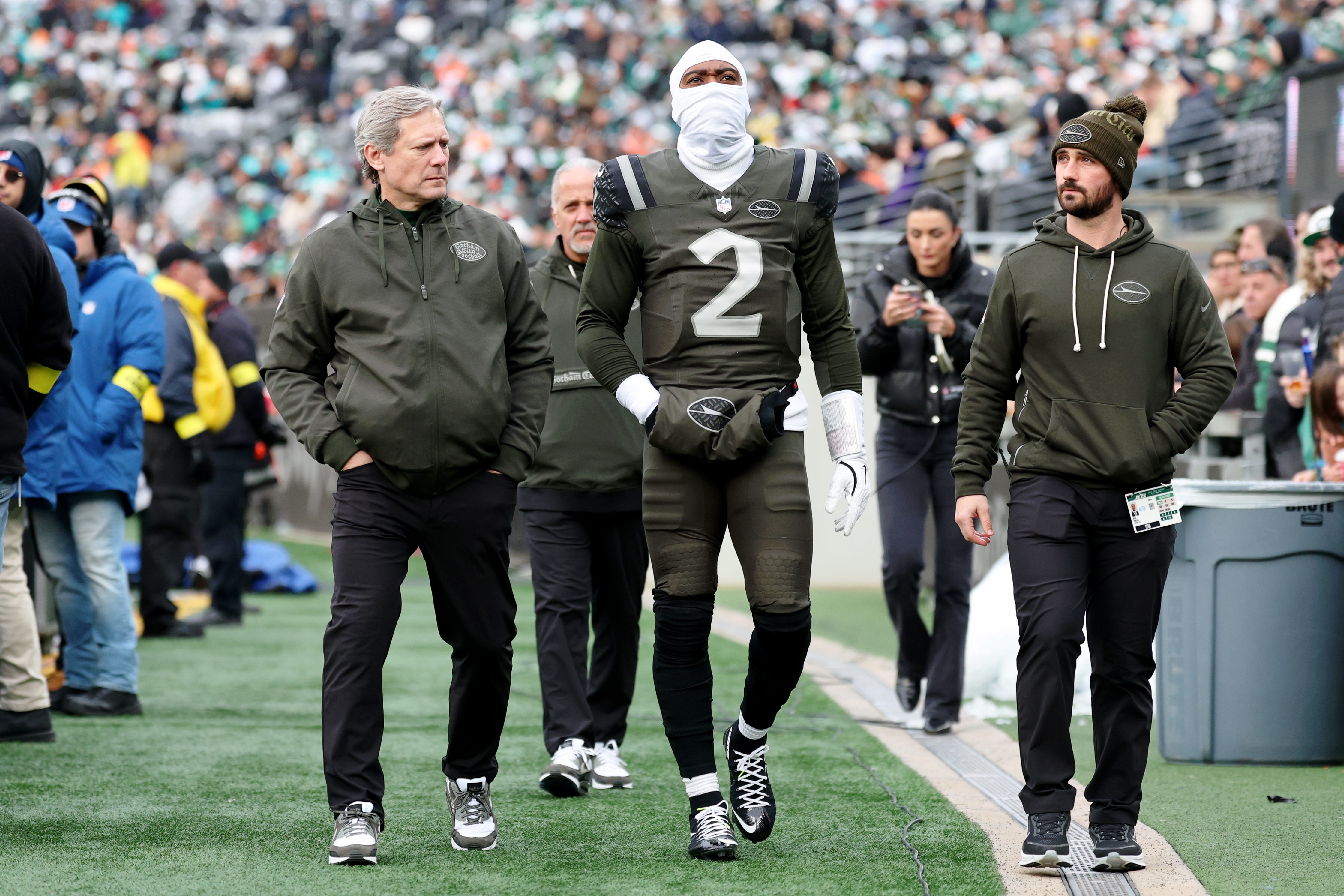 Dec 7, 2025; East Rutherford, New Jersey, USA; New York Jets quarterback Tyrod Taylor (2) walks off the field after an apparent injury during the first half at MetLife Stadium. Mandatory Credit: Vincent Carchietta-Imagn Images