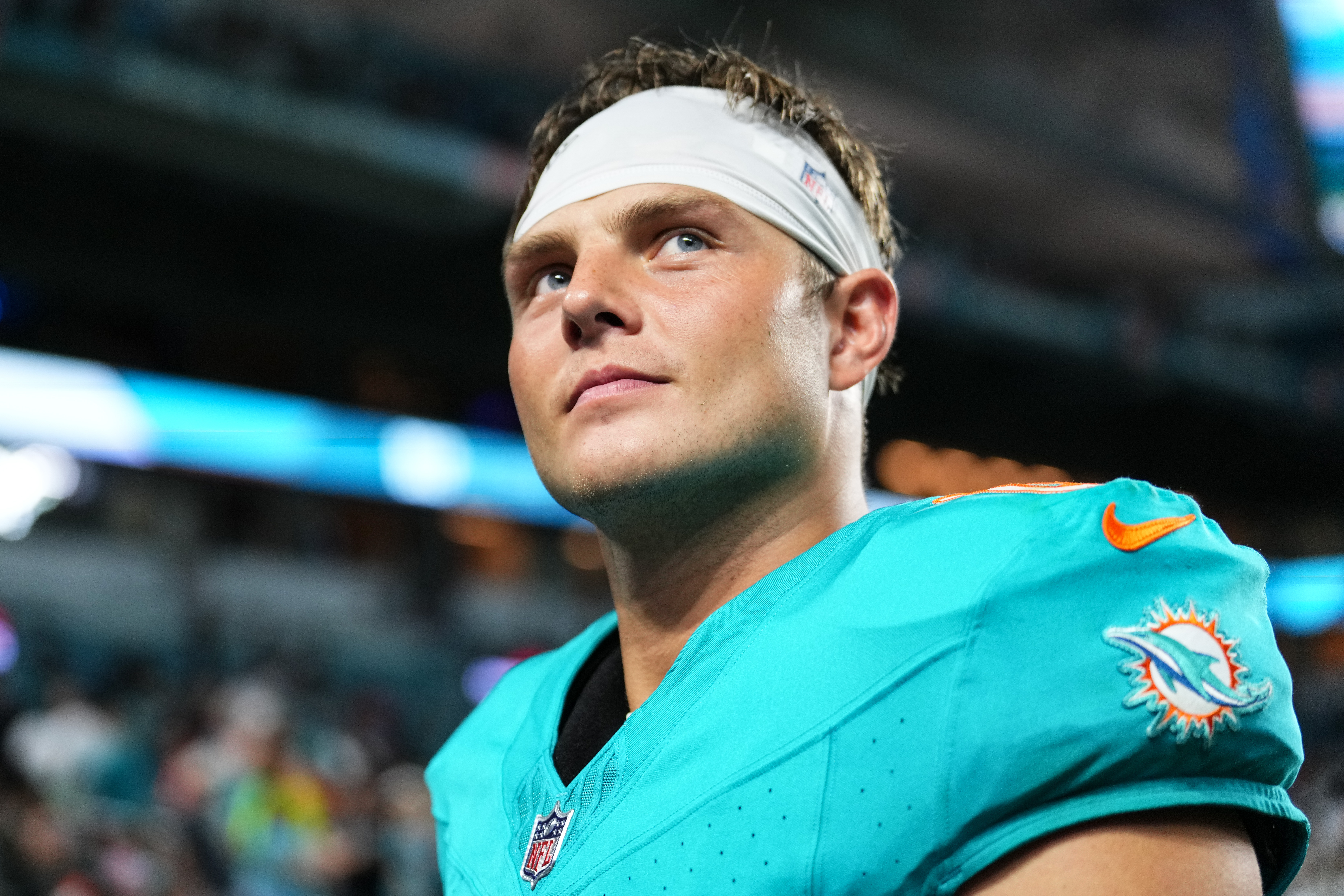 MIAMI GARDENS, FLORIDA - AUGUST 23: Zach Wilson #0 of the Miami Dolphins leaves the field at the end of a NFL Preseason 2025 game between Jacksonville Jaguars and Miami Dolphins at Hard Rock Stadium on August 23, 2025 in Miami Gardens, Florida. (Photo by Rich Storry/Getty Images)