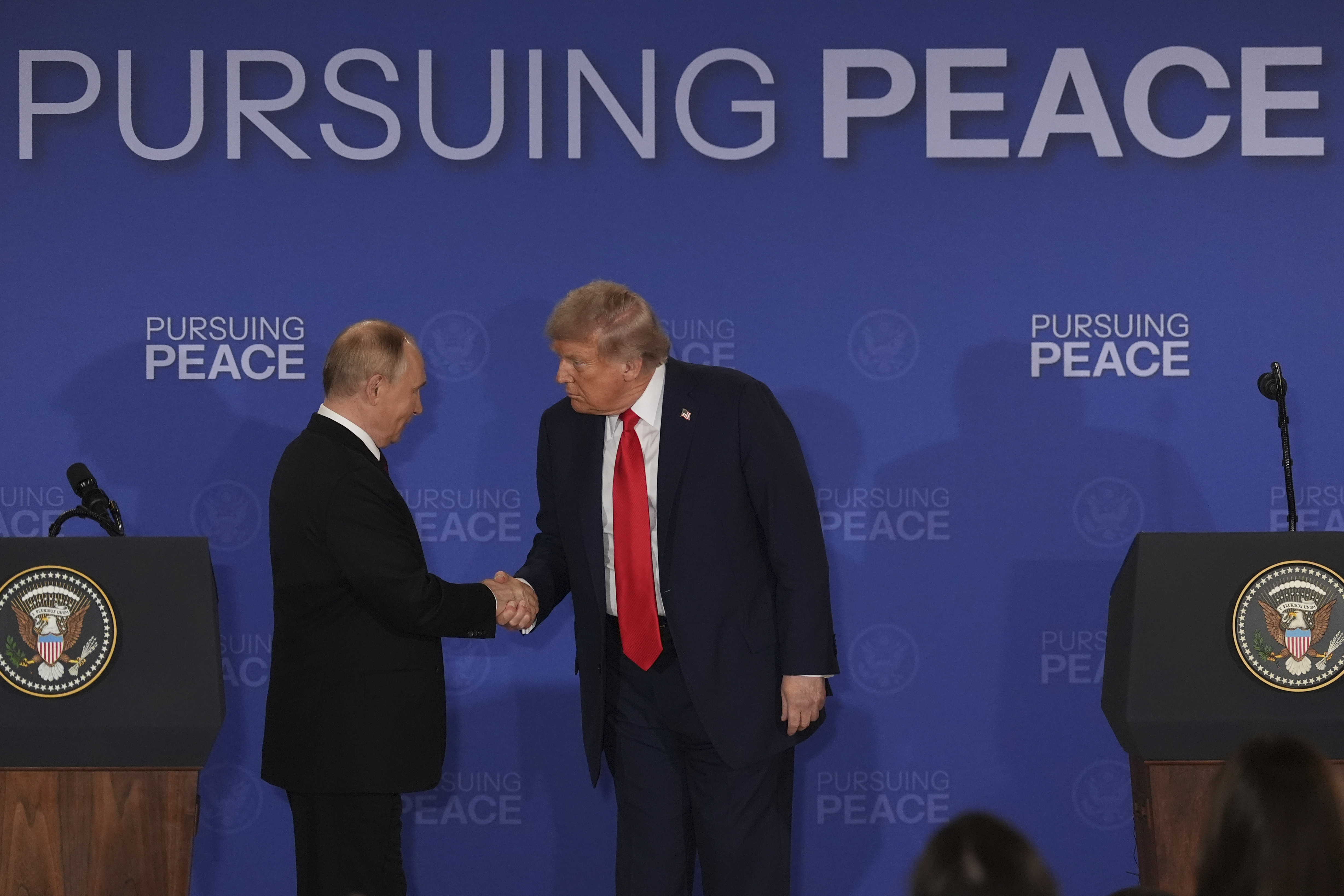 President Donald Trump, right, shakes the hand of Russia's President Vladimir Putin during a joint press conference at Joint Base Elmendorf-Richardson, Alaska, Friday, Aug. 15, 2025. (AP Photo/Jae C. Hong)