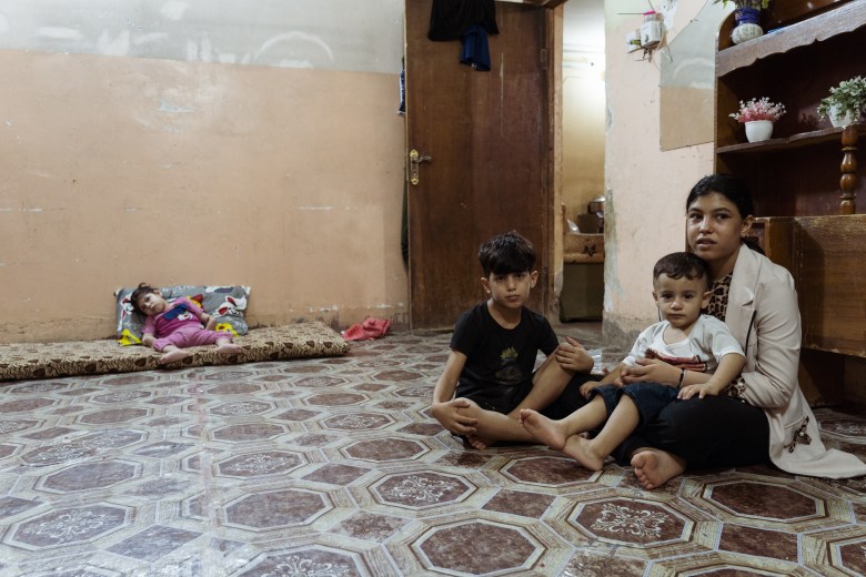 Confined to a mattress in her Fallujah home, Jannat lives paralyzed from a condition tied to the war’s toxic legacy, leaving her family with unending medical and financial burdens. Photo by Jaclynn Ashly.