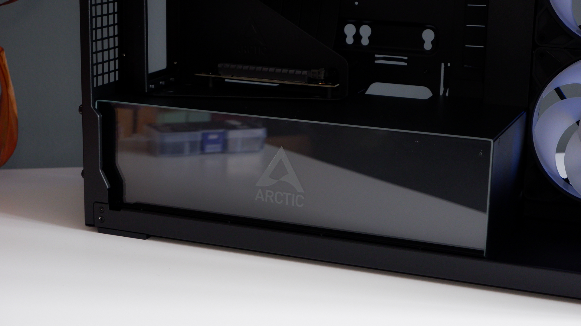 Arctic's Xtender PC case on a white desk with various parts being installed to build a functional gaming PC.