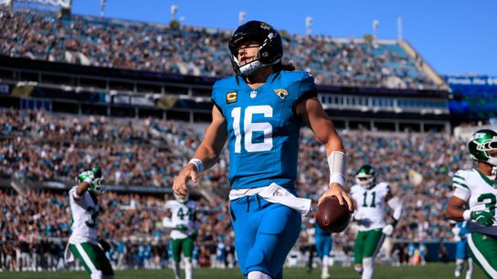 Jacksonville Jaguars quarterback Trevor Lawrence (16) scores a touchdown on a keeper during the first quarter of an NFL football matchup at EverBank Stadium, Sunday, Dec. 14, 2025, in Jacksonville, Fla.