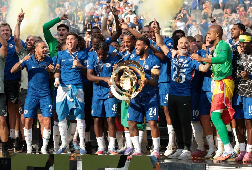 EAST RUTHERFORD, NEW JERSEY - JULY 13: Malo Gusto, Enzo Fernandez, Romeo Lavia, Joao Pedro, Reece James, Enzo Maresca, Robert Sanchez of Chelsea celebrate during the trophy ceremony following the FIFA Club World Cup 2025 final football match between Chelsea FC and Paris Saint-Germain (PSG) at MetLife Stadium on July 13, 2025 in East Rutherford, New Jersey. (Photo by Jean Catuffe/Getty Images)