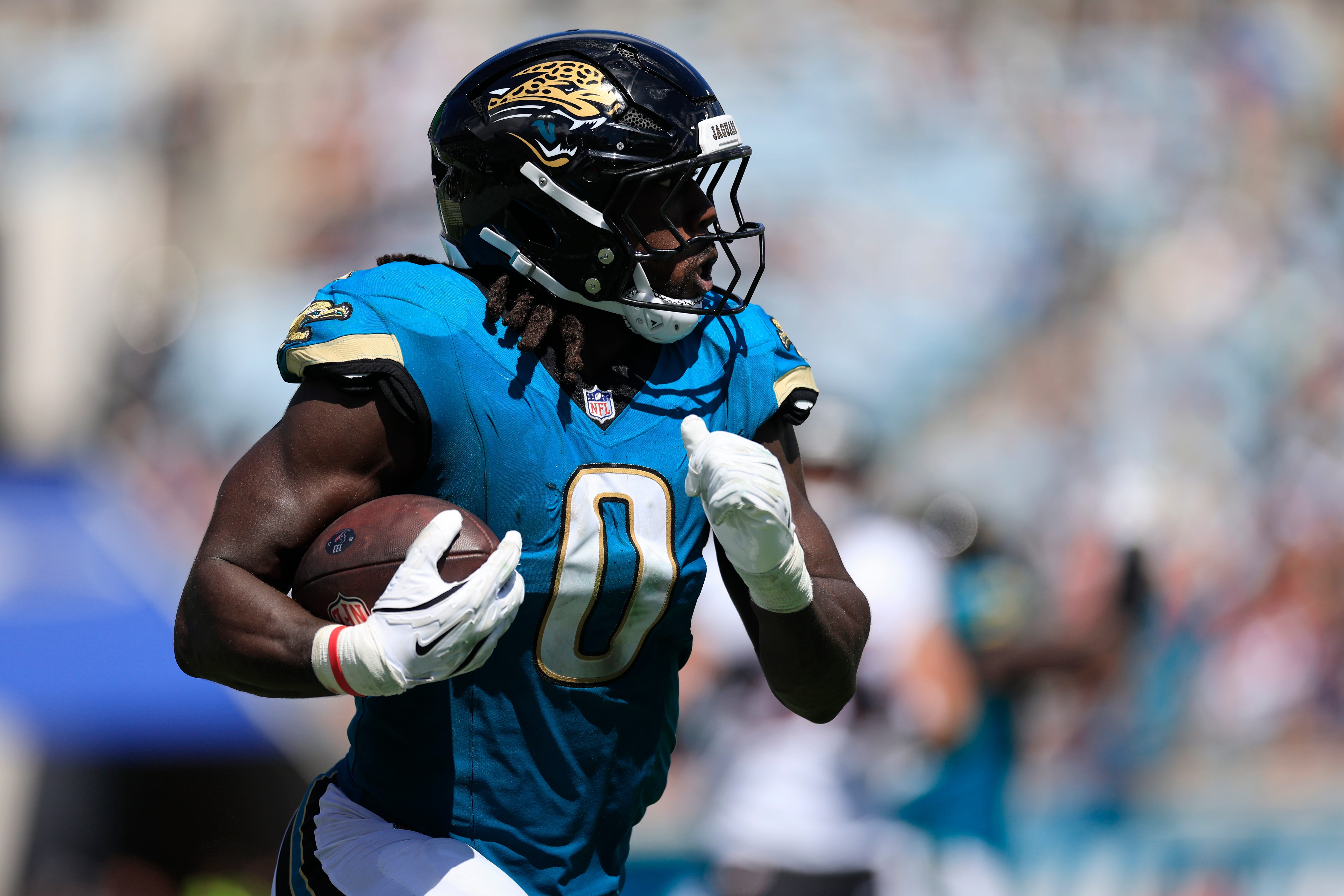 Jacksonville Jaguars linebacker Devin Lloyd (0) rushes for yards during the second quarter of an NFL football matchup at EverBank Stadium, Sunday, Sept. 21, 2025, in Jacksonville, Fla.