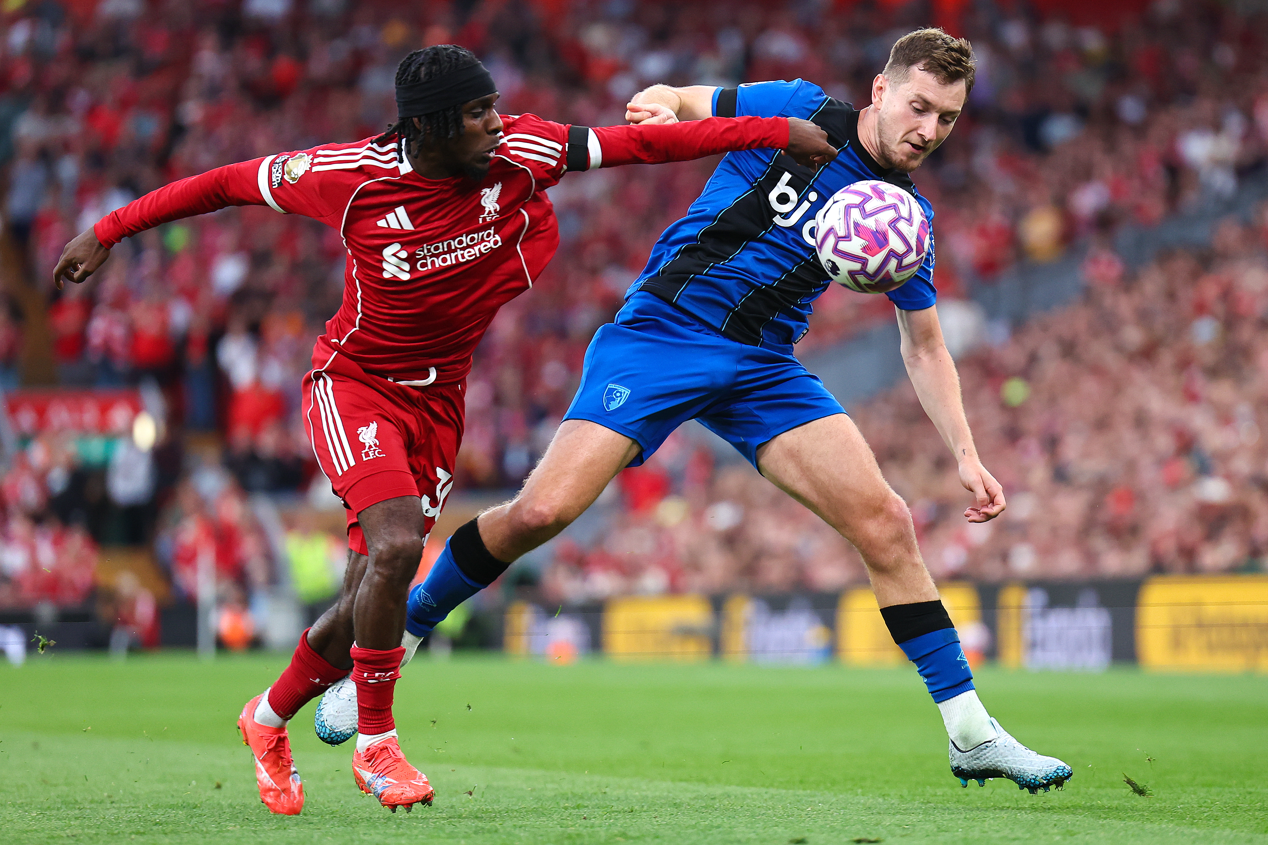 LIVERPOOL, ENGLAND - AUGUST 15: Jeremie Frimpong of Liverpool and David Brooks of Bournemouth during the Premier League match between Liverpool and Bournemouth at Anfield on August 15, 2025 in Liverpool, England. (Photo by Robbie Jay Barratt - AMA/Getty Images)