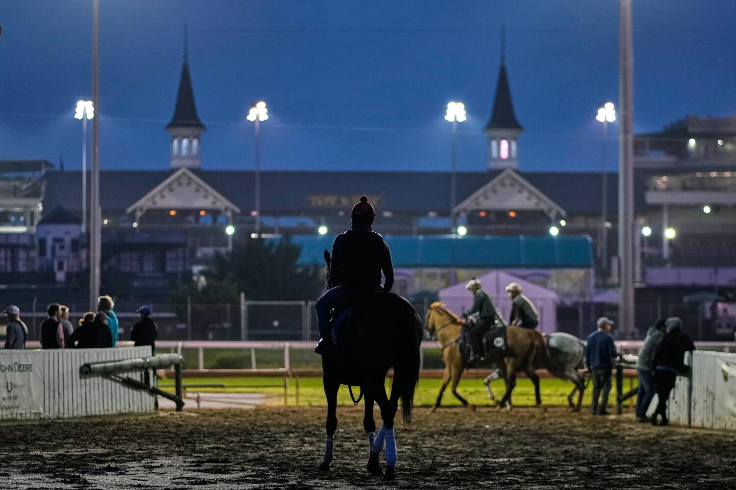 A horse heads to the track for a workout at Churchill Downs on Tuesday in Louisville, Ky.