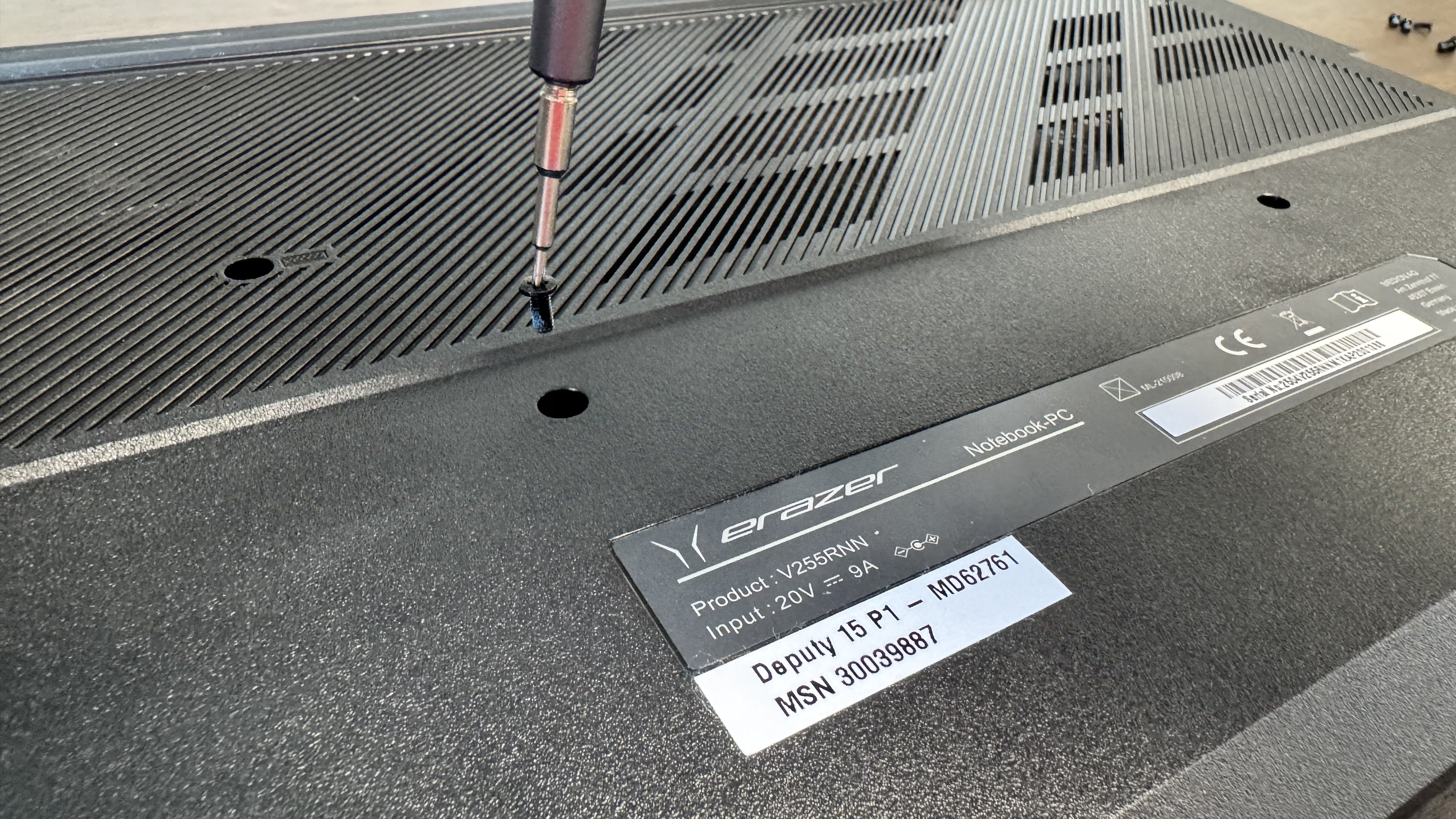 The Medion Deputy Erazer 15 P1 gaming laptop from the back with a screw missing