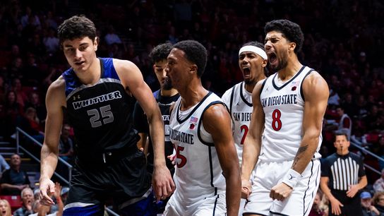 San Diego State players react to a dunk by San Diego State forward Jeremiah Oden (25) during an NCAA Basketball game between Whittier and San Diego State, Monday December 22, 2025 at Viejas Arena in San Diego, Calif.