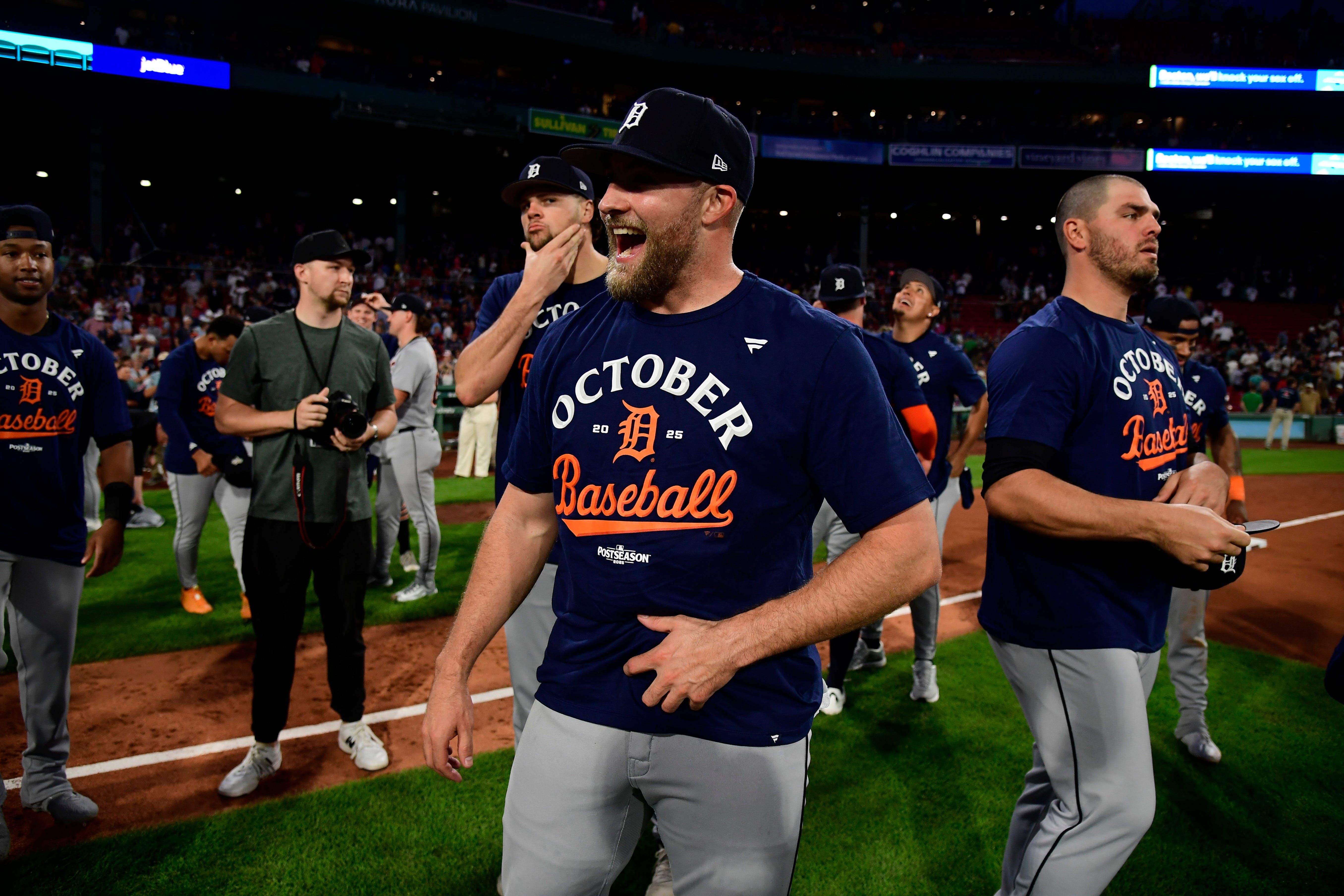 The Detroit Tigers celebrate after clinching a playoff berth after defeating the Boston Red Sox, 2-1, at Fenway Park, Saturday, Sept. 27, 2025.