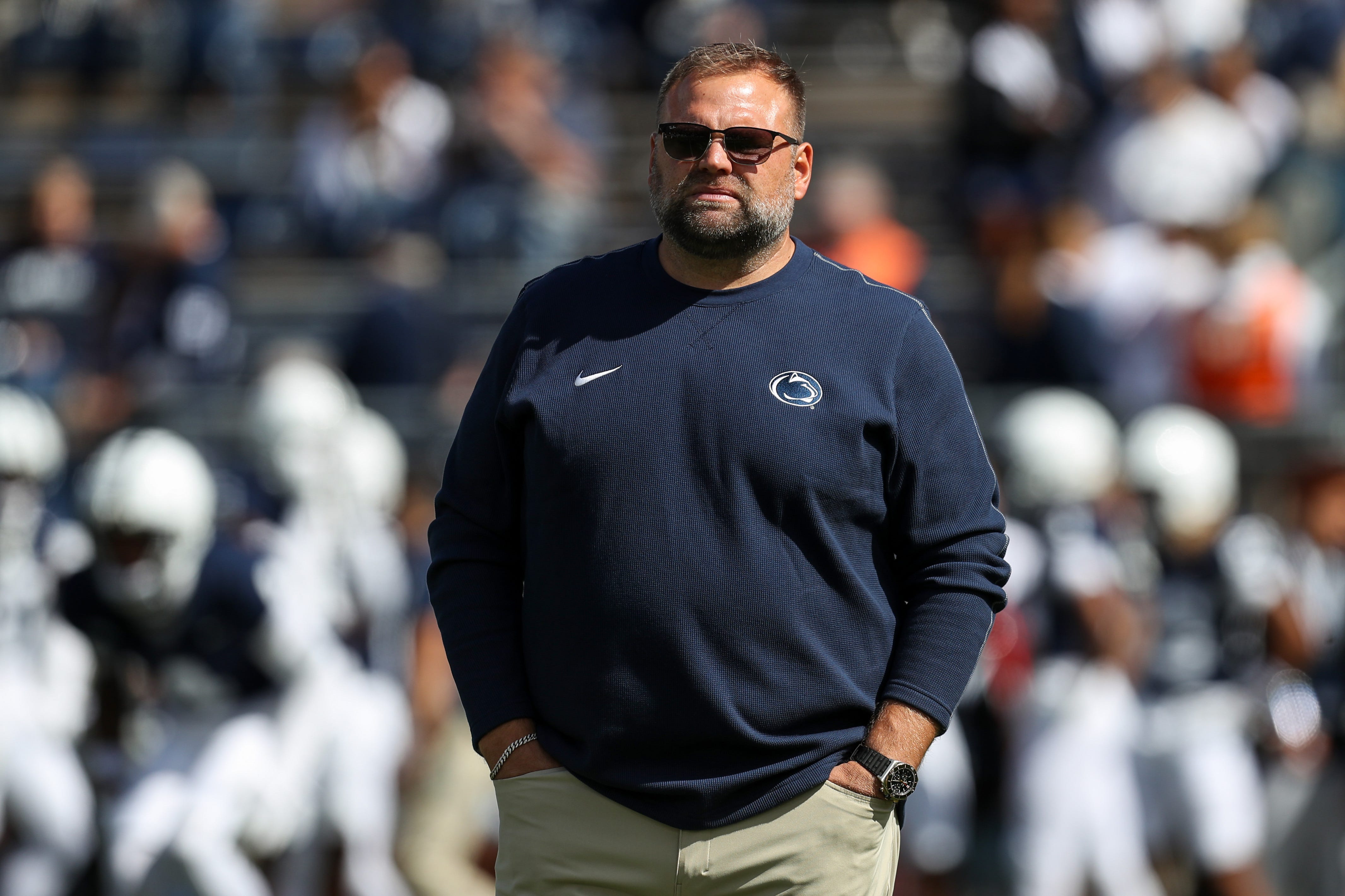 Sep 7, 2024; University Park, Pennsylvania, USA; Penn State Nittany Lions offensive coordinator Andy Kotelnicki walks on the field during a warm up prior to the game against the Bowling Green Falcons at Beaver Stadium. Mandatory Credit: Matthew O'Haren-Imagn Images