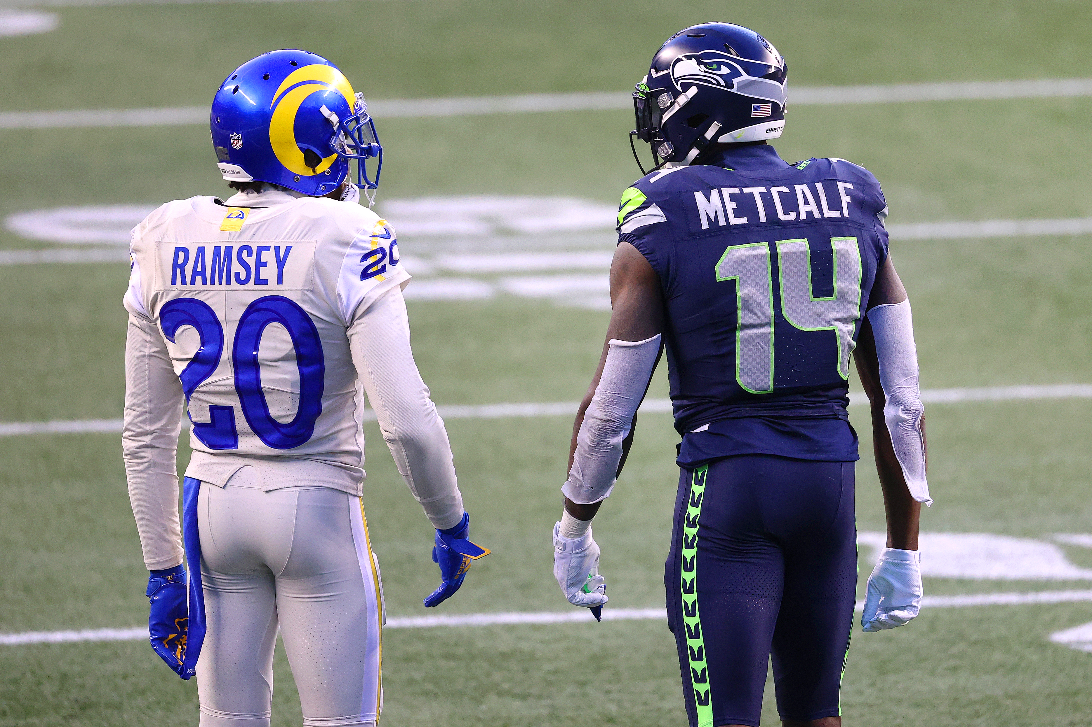 SEATTLE, WASHINGTON - DECEMBER 27: Jalen Ramsey #20 of the Los Angeles Rams and DK Metcalf #14 of the Seattle Seahawks have a conversation in the fourth quarter at Lumen Field on December 27, 2020 in Seattle, Washington. (Photo by Abbie Parr/Getty Images)