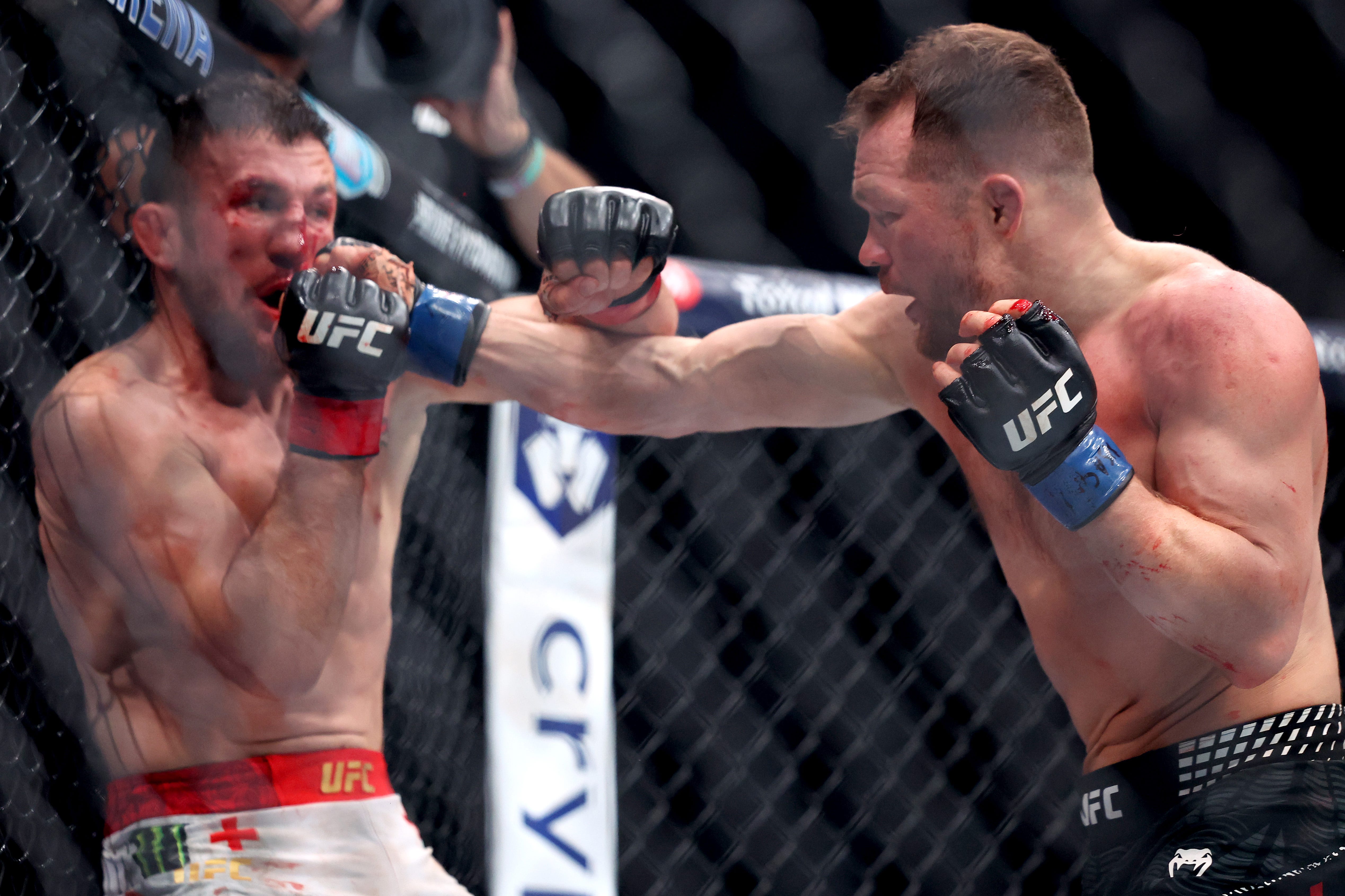 LAS VEGAS, NEVADA - DECEMBER 06: Petr Yan (R) punches Merab Dvalishvili of Georgia in a bantamweight title bout during UFC 323 at T-Mobile Arena on December 06, 2025 in Las Vegas, Nevada. (Photo by Ian Maule/Getty Images)