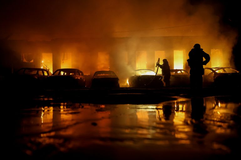 Rescue workers put out a fire of cars destroyed by a Russian drone strike in Zaporizhzhia, Ukraine, on Wednesday, June 18, 2025. (AP Photo/Kateryna Klochko)