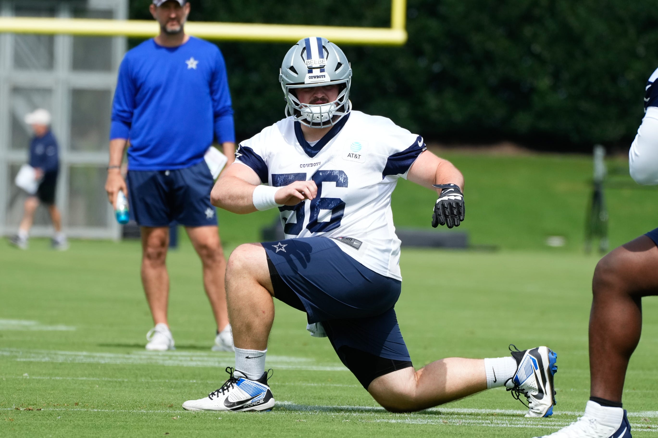 Jun 5, 2024; Frisco, TX, USA; Dallas Cowboys center Cooper Beebe (56) goes through a drill during practice at the Ford Center at the Star Training Facility in Frisco, Texas. Mandatory Credit: Chris Jones-USA TODAY Sports