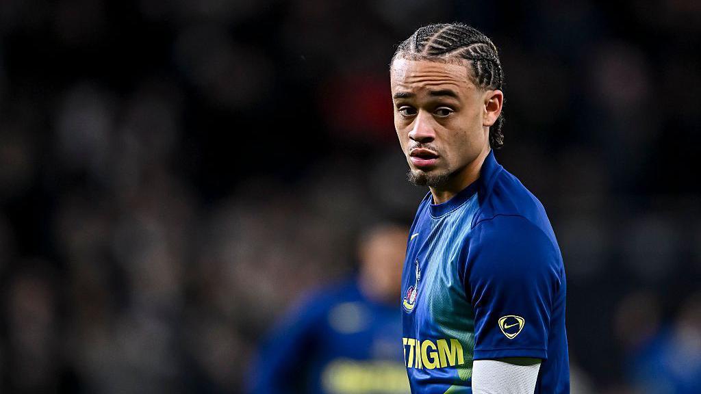 Xavi Simons of Tottenham warms up