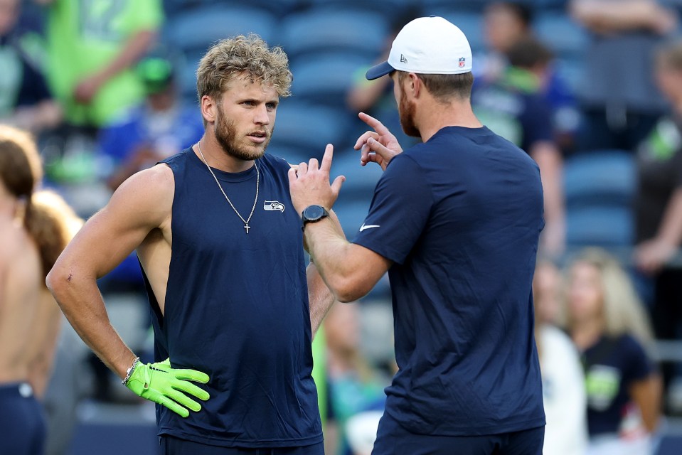SEATTLE, WASHINGTON - AUGUST 07: Sam Darnold #14 and Cooper Kupp #10 of the Seattle Seahawks warm up before the NFL Preseason 2025 game between Las Vegas Raiders and Seattle Seahawks at Lumen Field on August 07, 2025 in Seattle, Washington. (Photo by Steph Chambers/Getty Images)
