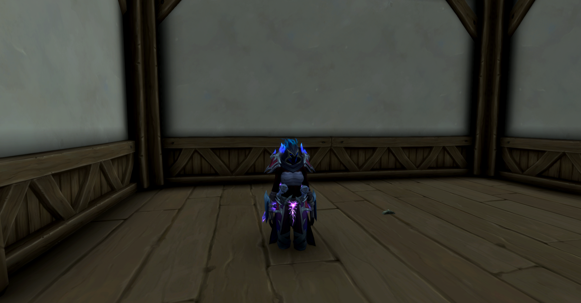 A rogue halfway clipped into the floor in World of Warcraft.