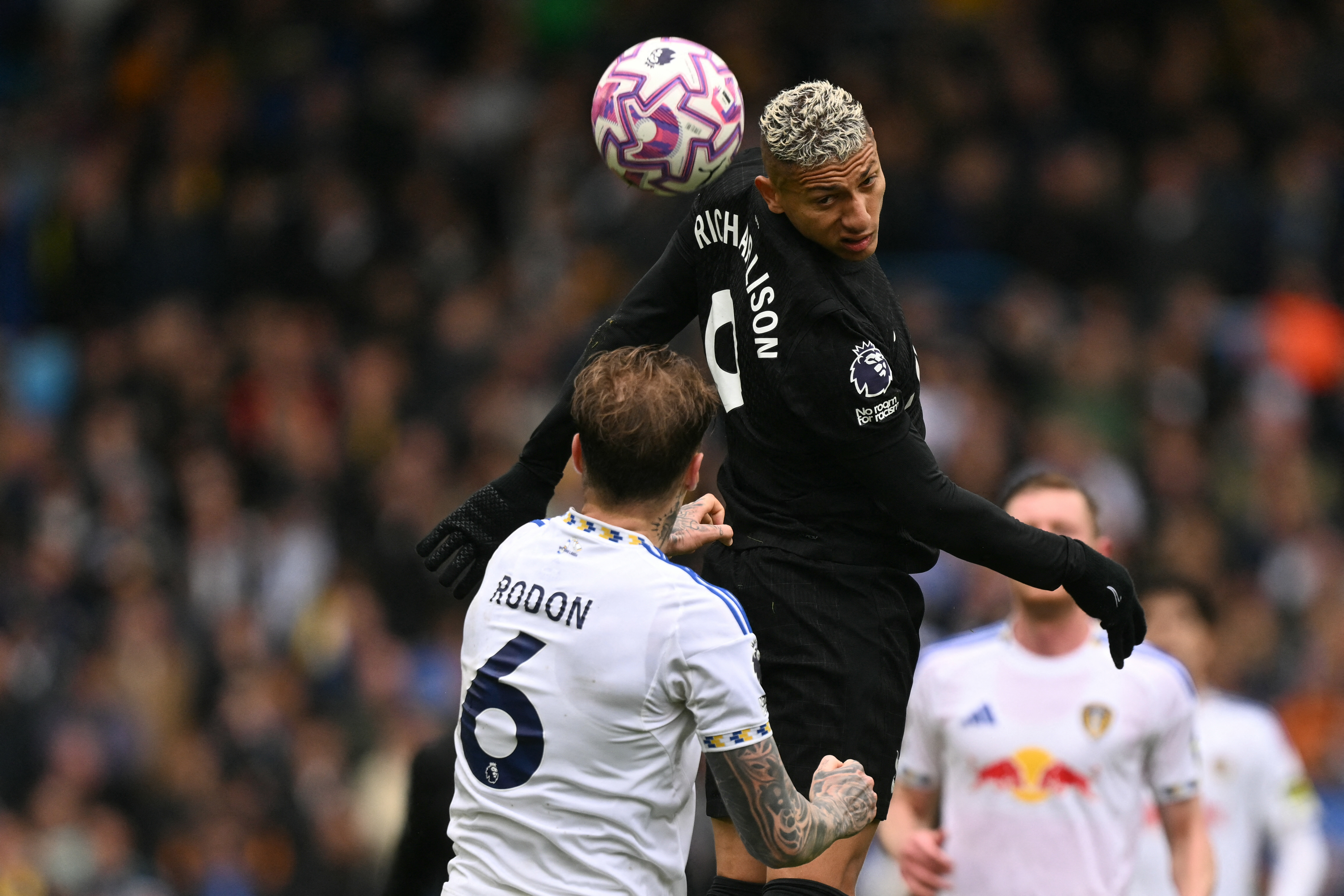 Tottenham striker Richarlison wins a header over Leeds United's Joe Rodon