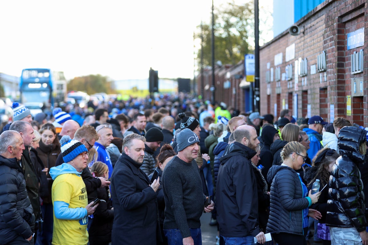 Fans queue outside the ground the day after the club entered administration (Getty Images)
