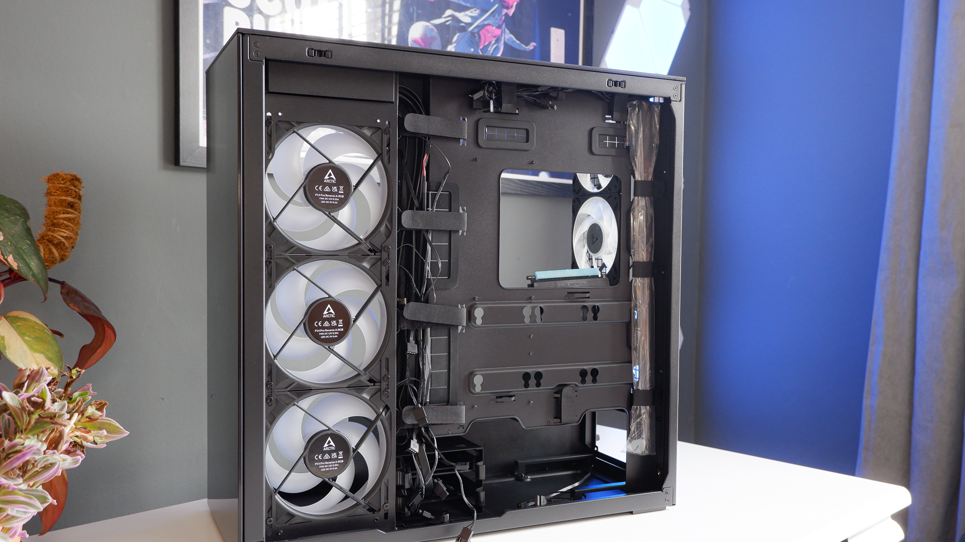 Arctic's Xtender PC case on a white desk with various parts being installed to build a functional gaming PC.