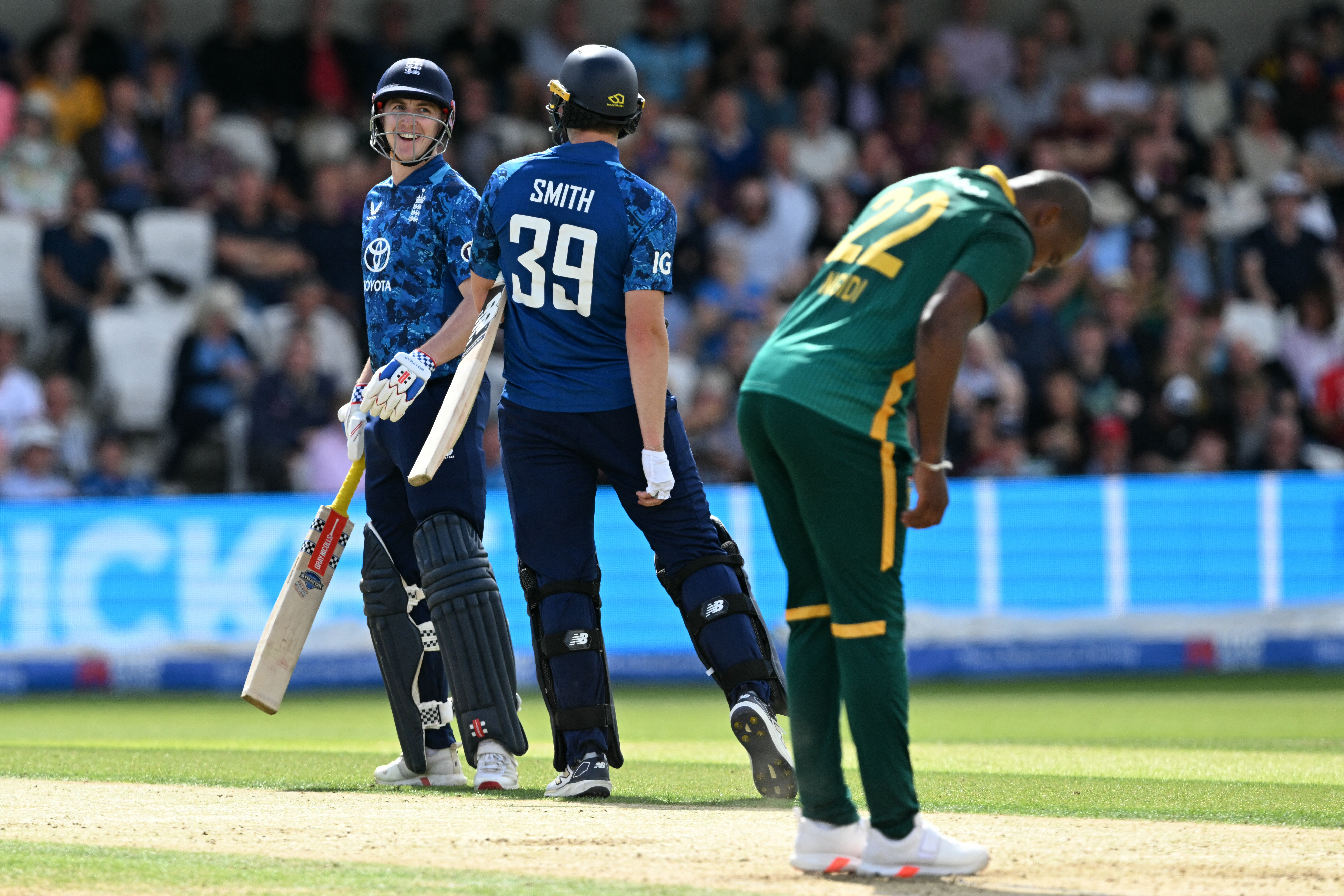 England's Harry Brook (L) smiles after hitting his first ball from South Africa's Lungi Ngidi to the boundary during the first One Day International (ODI) cricket match between England and South Africa at Headingley, in Leeds, on September 2, 2025. (Photo by Oli SCARFF / AFP) / RESTRICTED TO EDITORIAL USE. NO ASSOCIATION WITH DIRECT COMPETITOR OF SPONSOR, PARTNER, OR SUPPLIER OF THE ECB (Photo by OLI SCARFF/AFP via Getty Images)