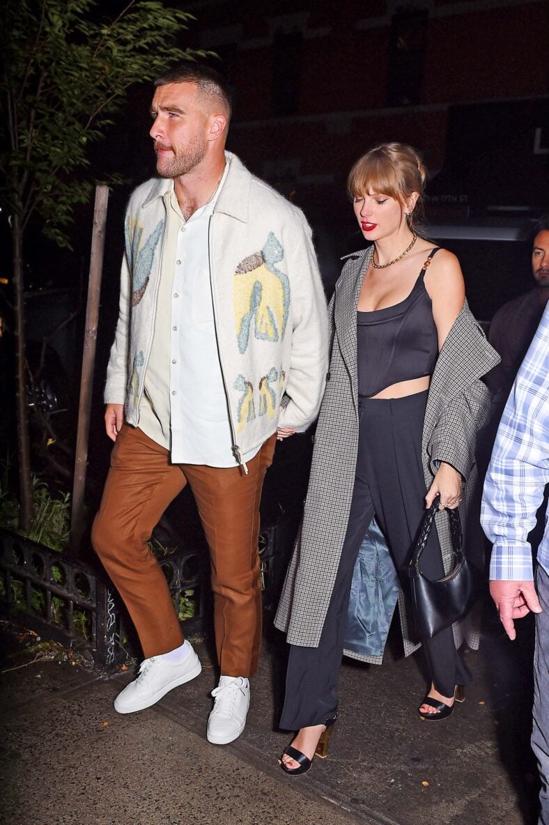 Taylor Swift and Travis Kelce hold hands as they arrive to the snl after party