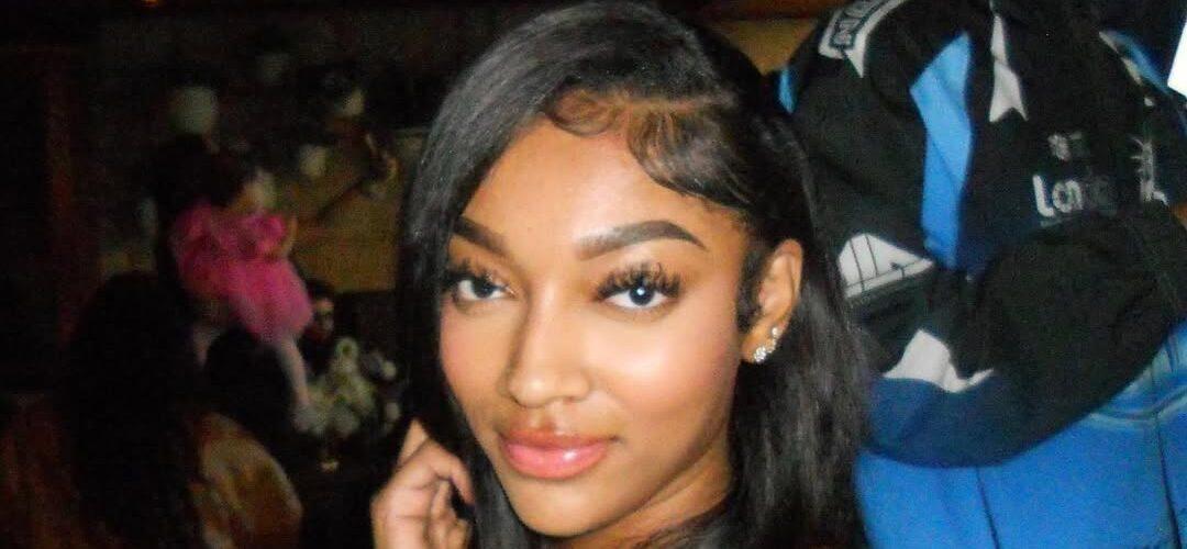 Angel Reese posing for a picture.