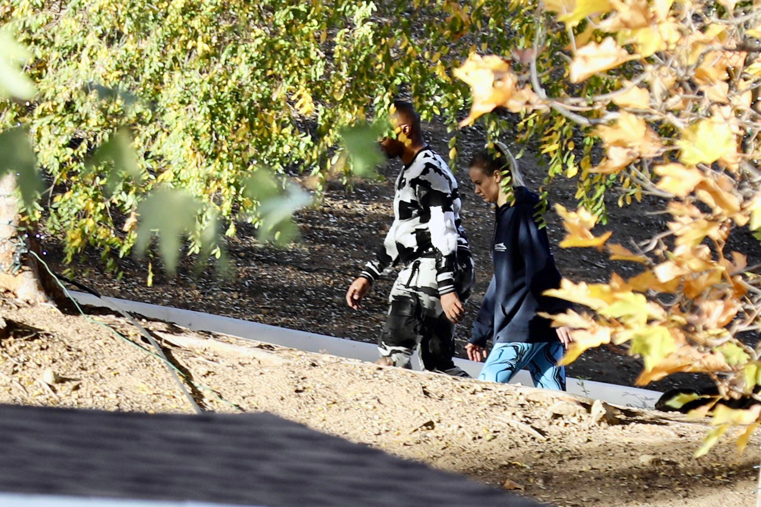 Actor Jamie Foxx is seen with his girlfriend Alyce Huckstepp taking their three dogs for a walk around his property which has been turned into a winter wonderland.