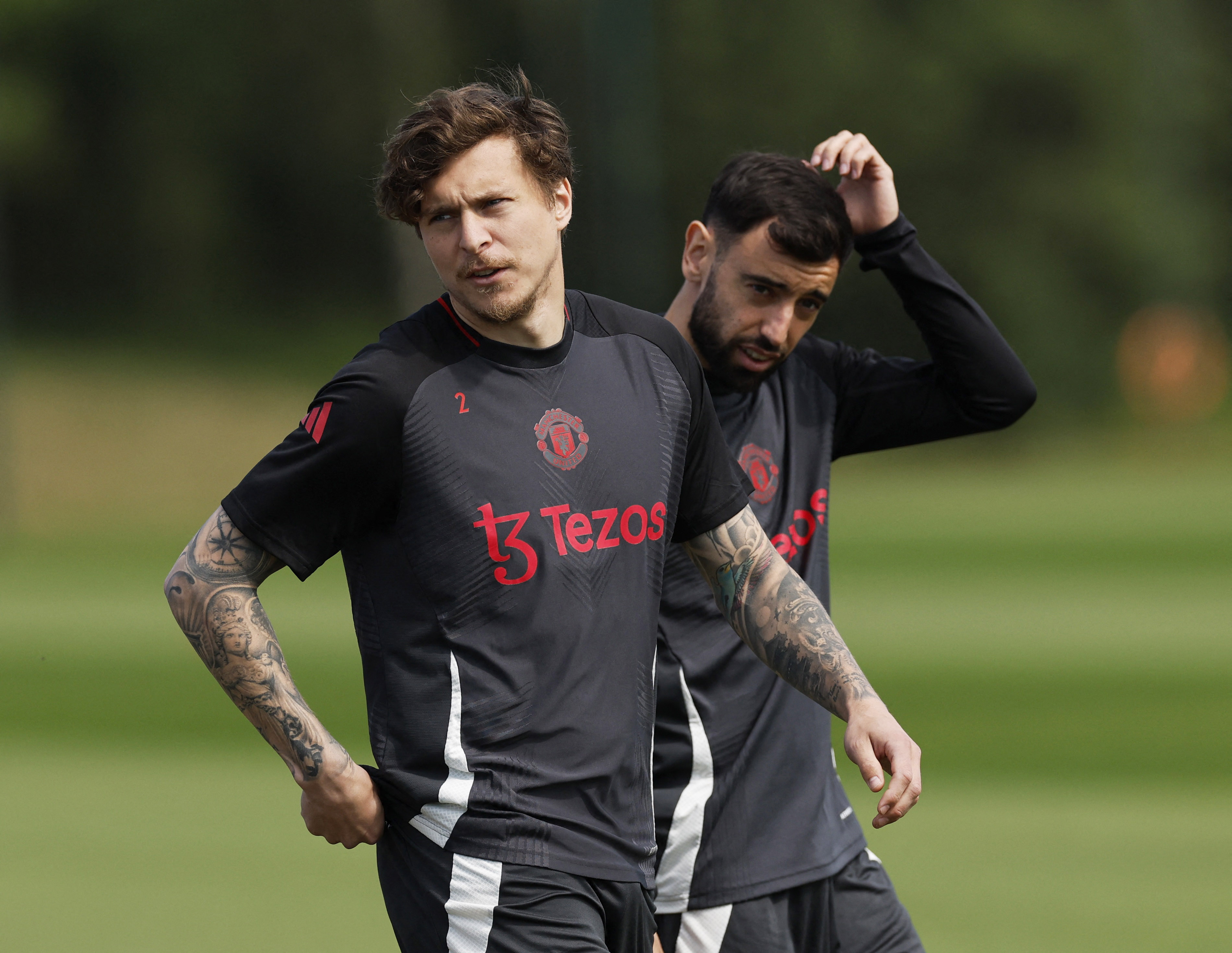 Soccer Football - Europa League - Europa League - Final - Manchester United Media Day - Trafford Training Centre, Carrington, Britain - May 14, 2025 Manchester United's Victor Lindelof and Bruno Fernandes during the media day Action Images via Reuters/Jason Cairnduff