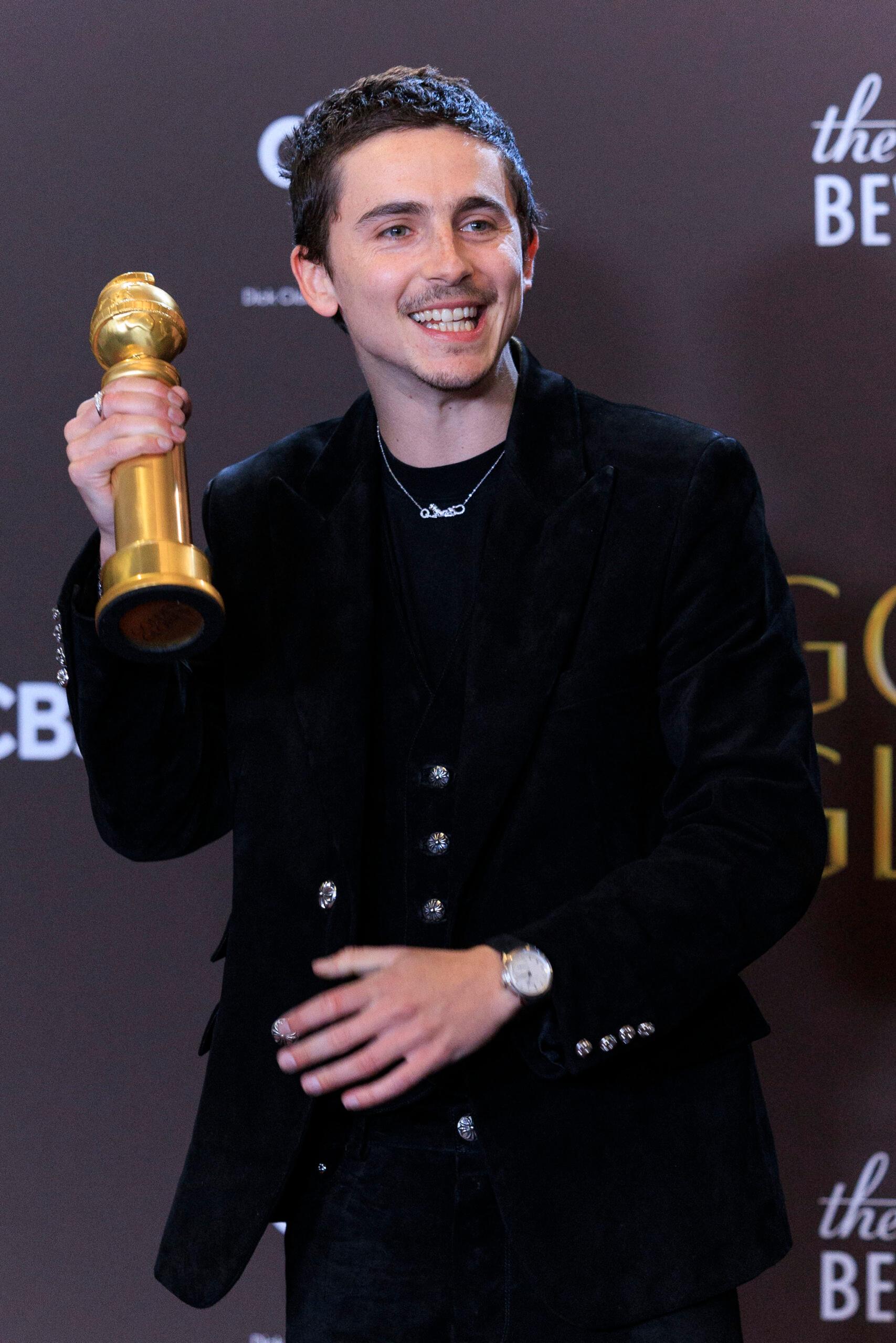 Timothee Chalamet with his Golden Globe Award