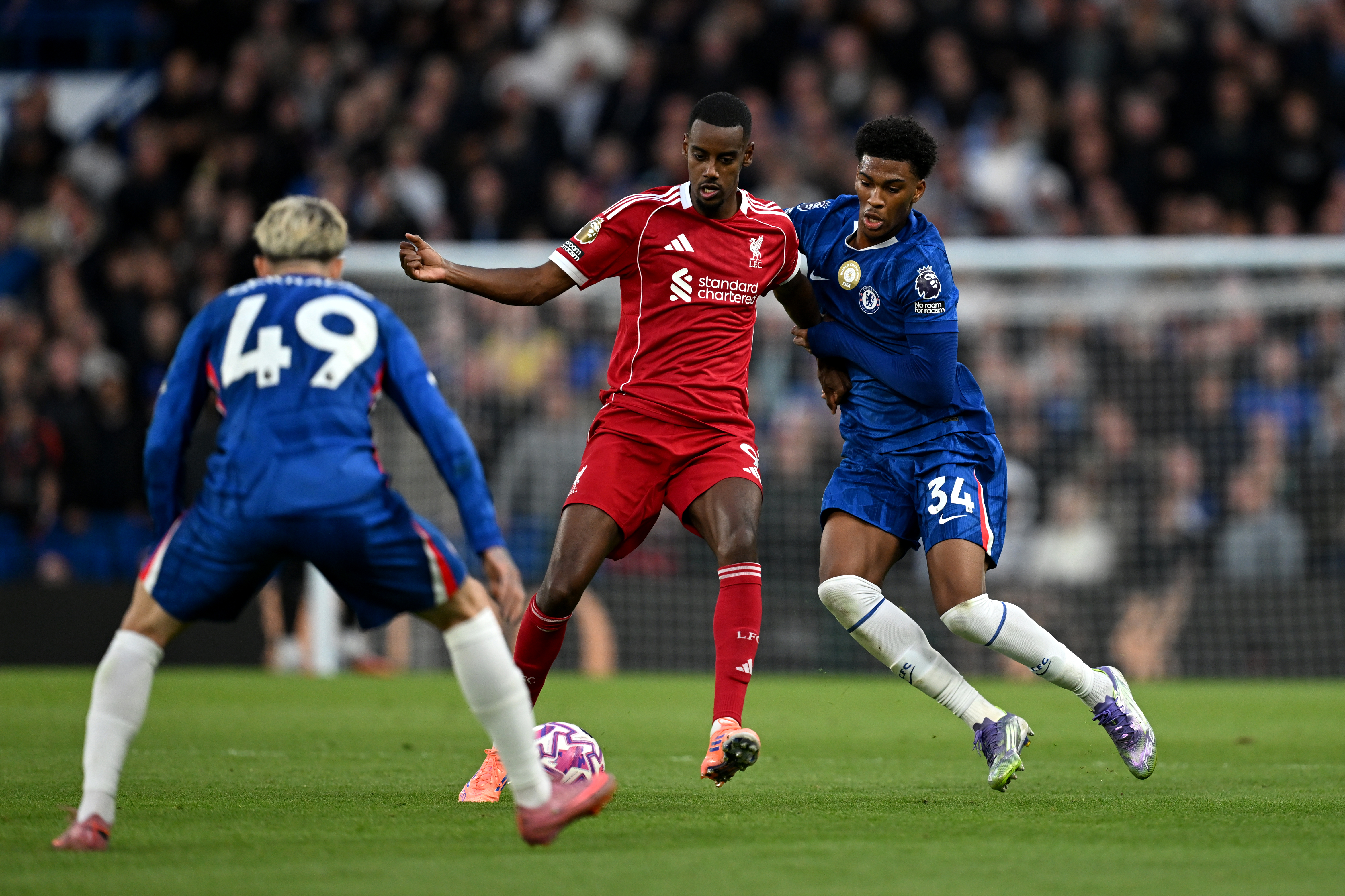 Alexander Isak challenges for the ball with Chelsea's Hosh Acheampong
