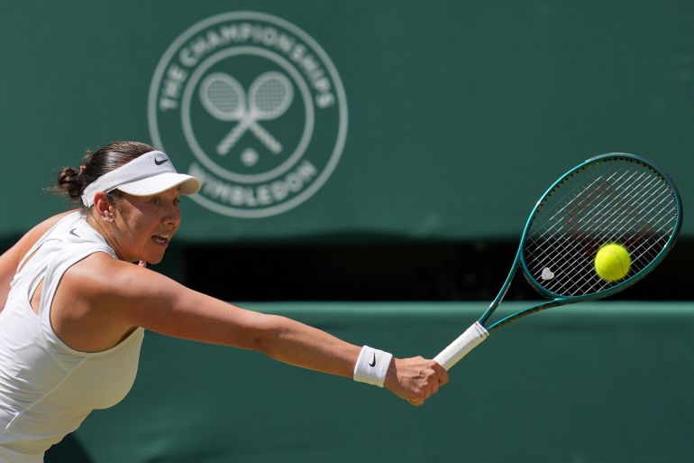 Amanda Anisimova of the U.S. returns to Aryna Sabalenka of Belarus during a women's singles semifinal match at the Wimbledon Tennis Championships in London, Thursday, July 10, 2025. (AP Photo/Kin Cheung)