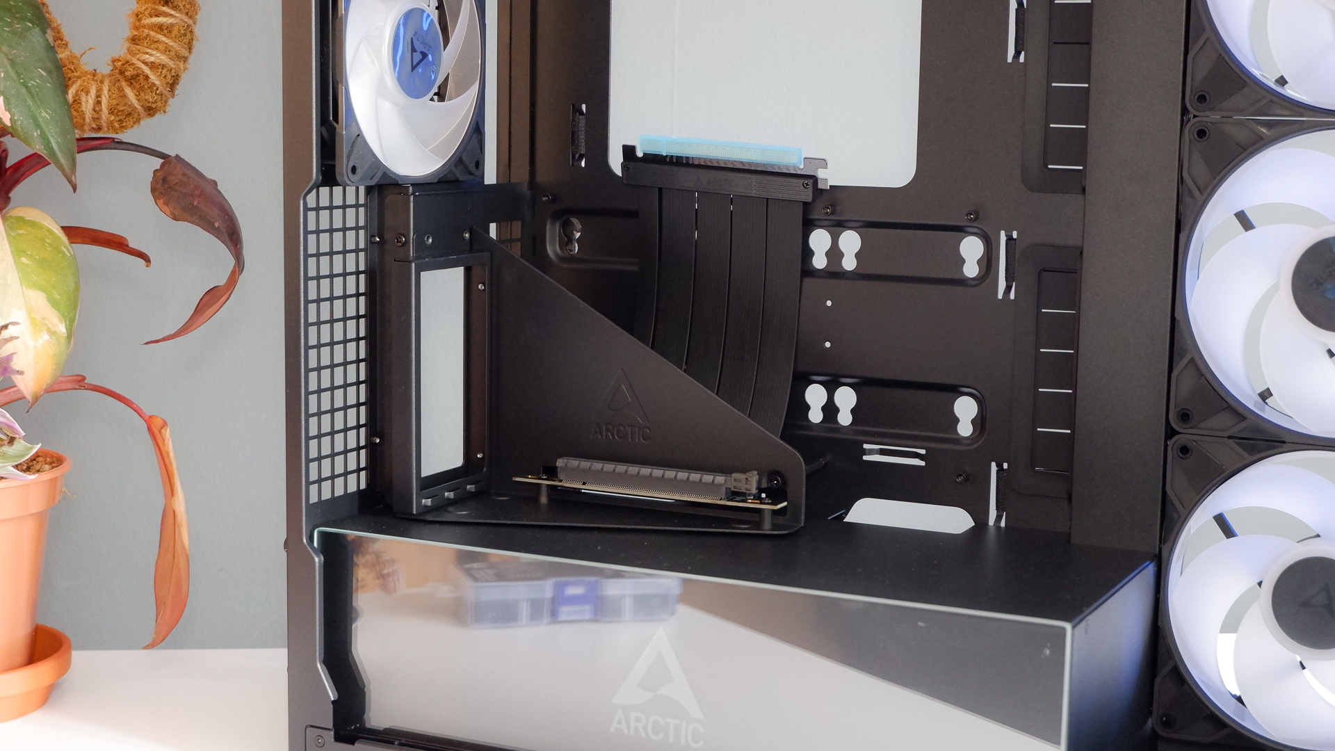 Arctic's Xtender PC case on a white desk with various parts being installed to build a functional gaming PC.