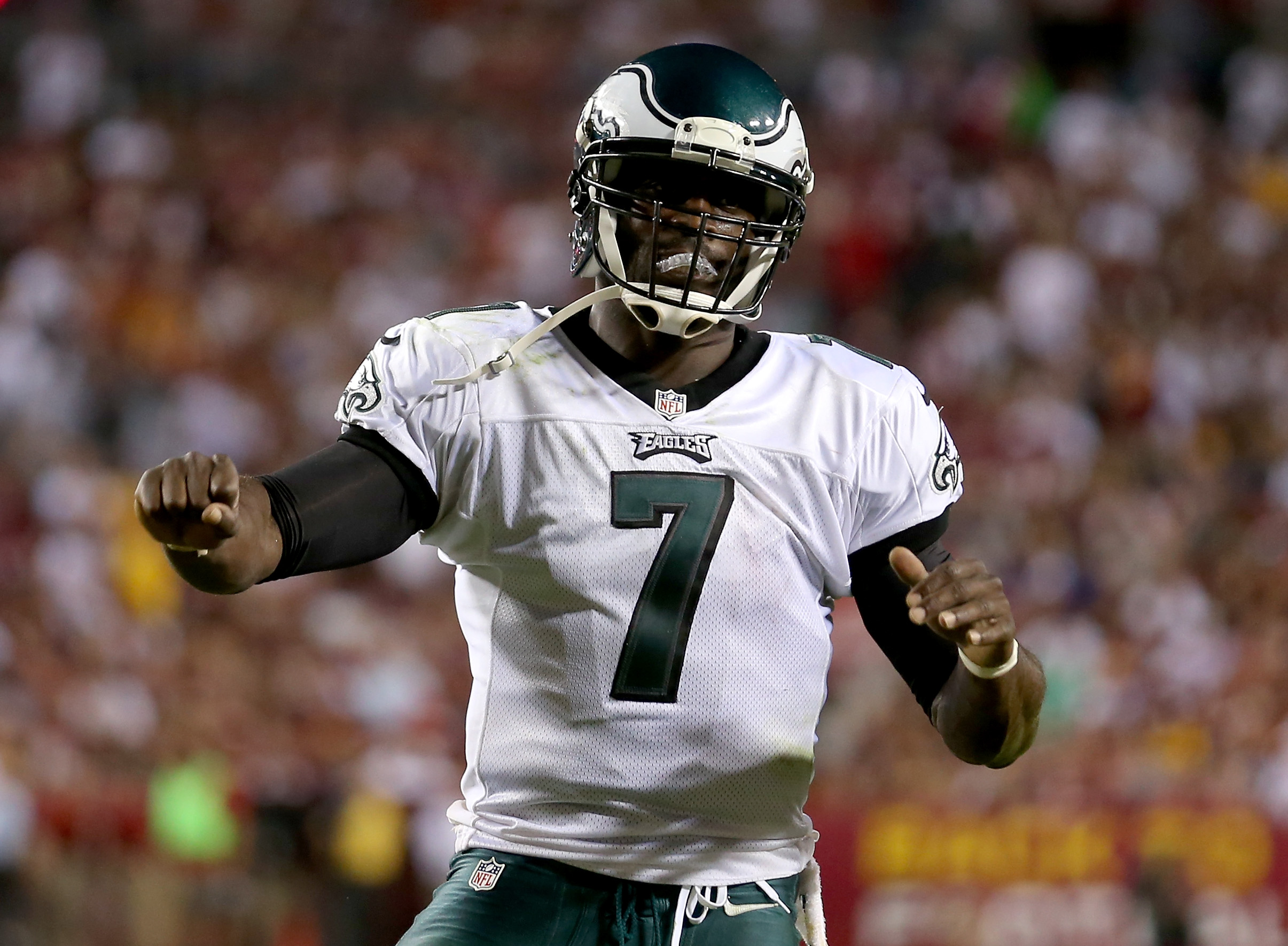 LANDOVER, MD - SEPTEMBER 09: Quarterback Michael Vick #7 of the Philadelphia Eagles celebrates after scoring on a three-yard touchdown run in the second quarter against the Washington Redskins at FedExField on September 9, 2013 in Landover, Maryland. (Photo by Rob Carr/Getty Images)