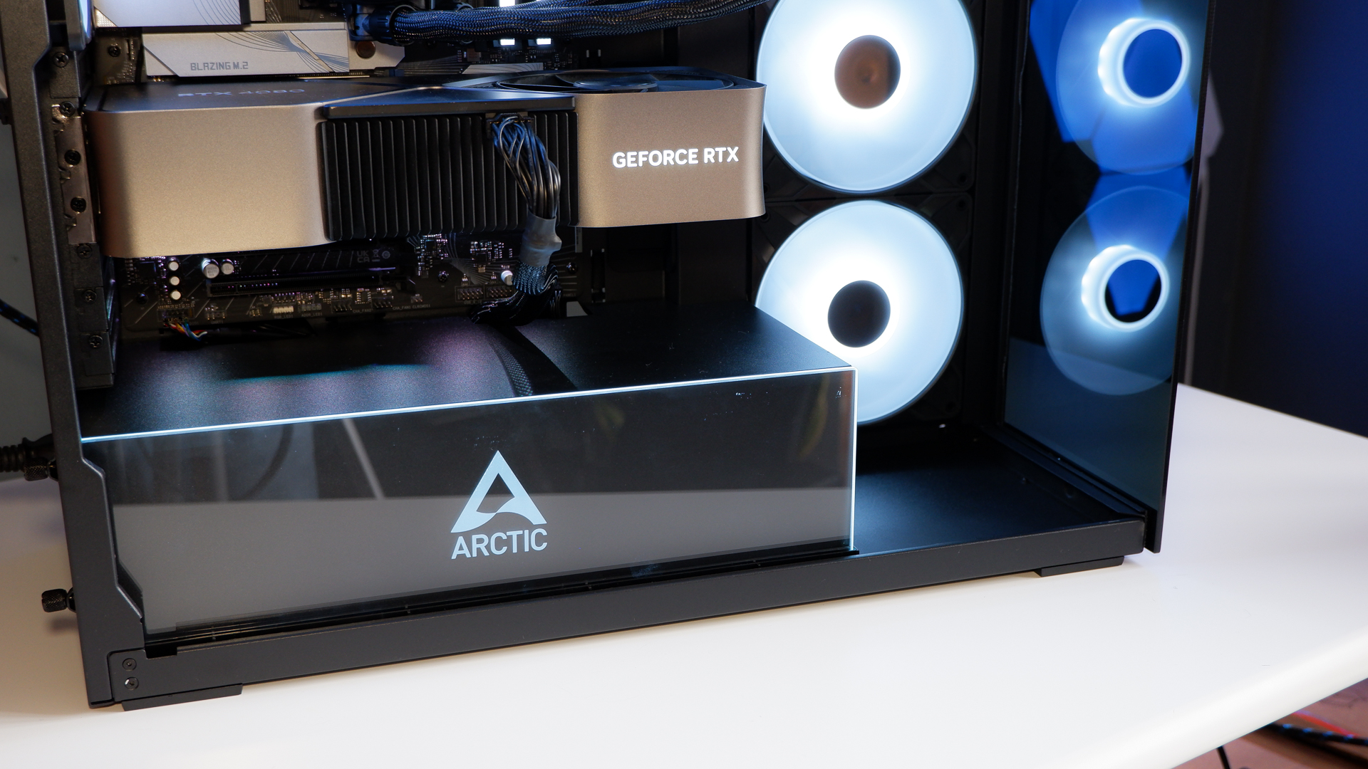 Arctic's Xtender PC case on a white desk with various parts being installed to build a functional gaming PC.