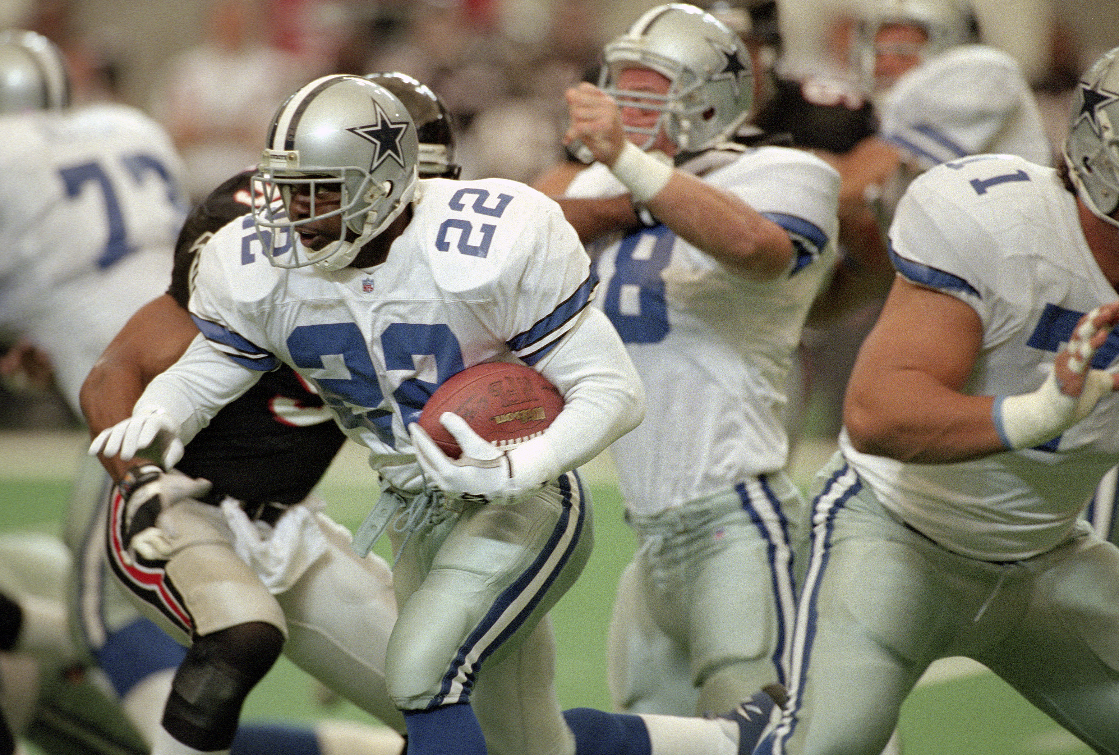 ATLANTA, GA - OCTOBER 29: Emmitt Smith #22 of the Dallas Cowboys carries the ball against the Atlanta Falcons October 29, 1995 during an NFL football game at the Georgia Dome in Atlanta, Georgia . Smith played for the Cowboys from 1990-02. (Photo by Focus on Sport/Getty Images)
