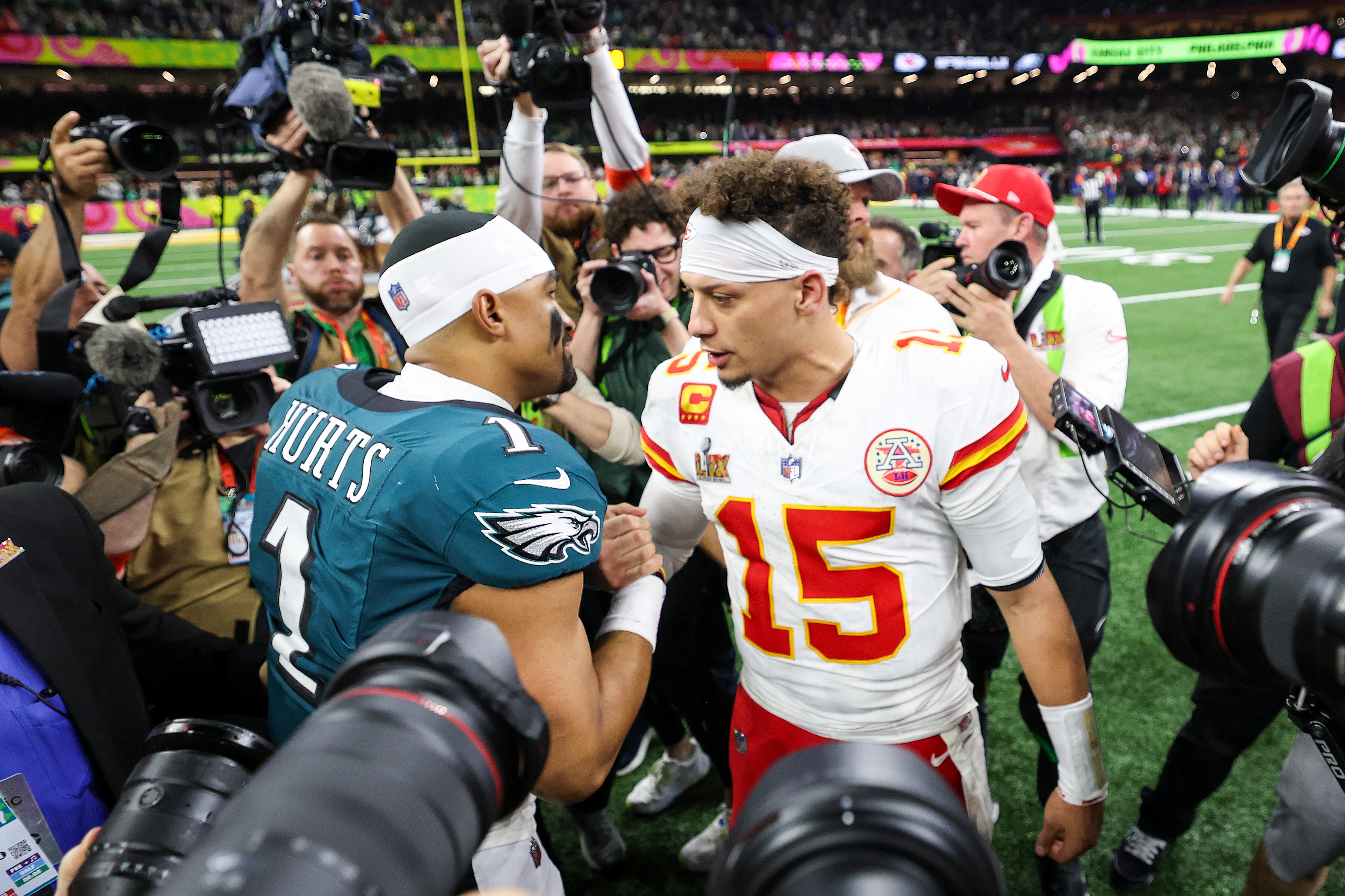 NEW ORLEANS, LOUISIANA - FEBRUARY 09: Jalen Hurts #1 of the Philadelphia Eagles and Patrick Mahomes #15 of the Kansas City Chiefs embrace after Super Bowl LIX at Caesars Superdome on February 09, 2025 in New Orleans, Louisiana. (Photo by Jamie Squire/Getty Images)