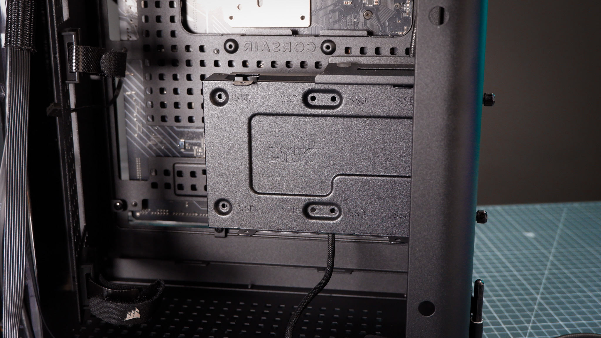 A Corsair Air 5400 PC case on a desk with various parts installed.