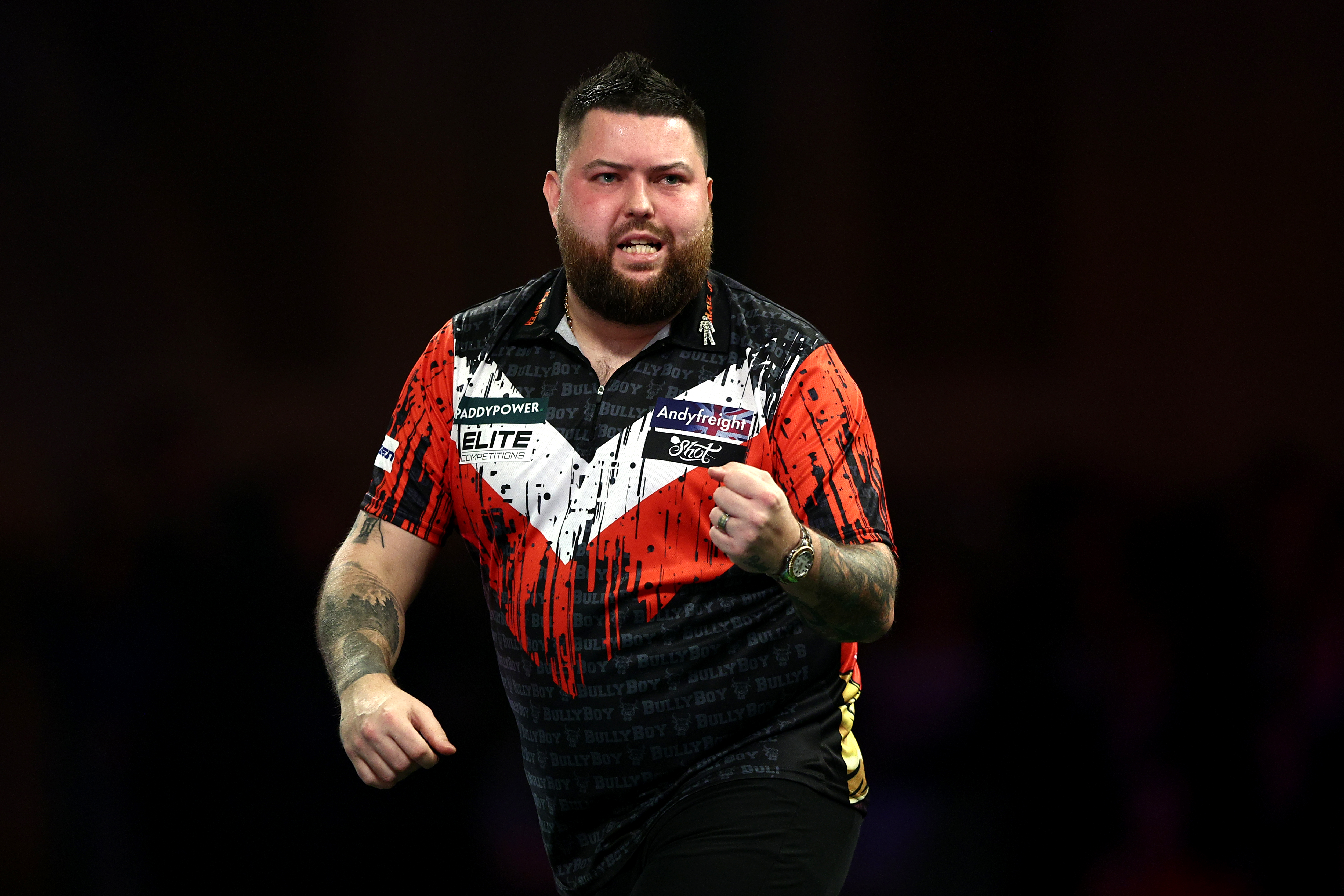 LONDON, ENGLAND - DECEMBER 19: Michael Smith of England reacts against Kevin Doets of Netherlands in their second round match during day five of the 2024/25 Paddy Power World Darts Championship at Alexandra Palace on December 19, 2024 in London, England. (Photo by James Fearn/Getty Images)