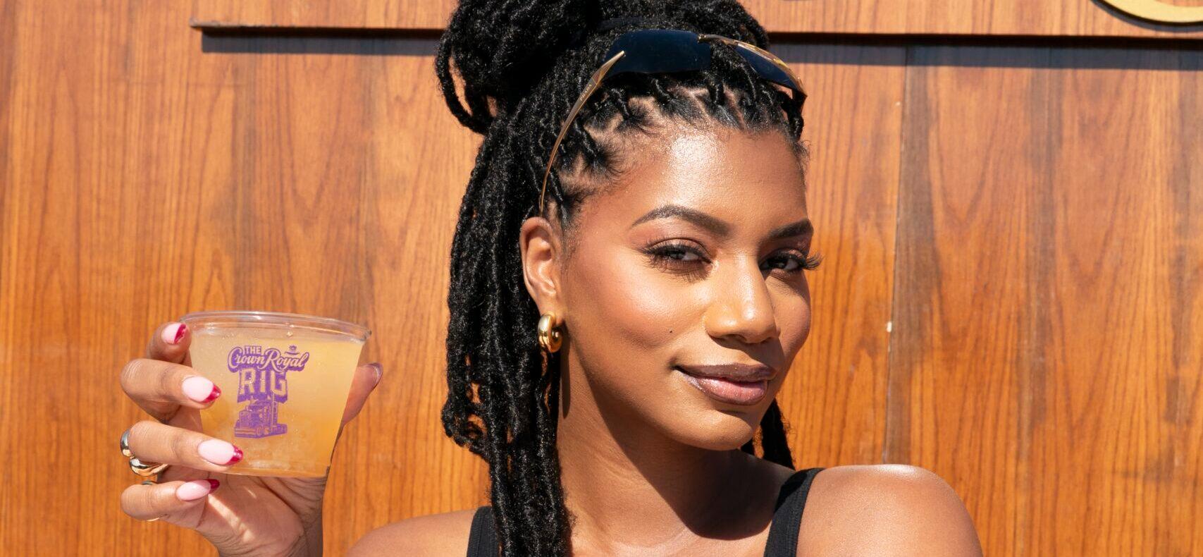 Taylor Rooks holding a Crown Royal drink