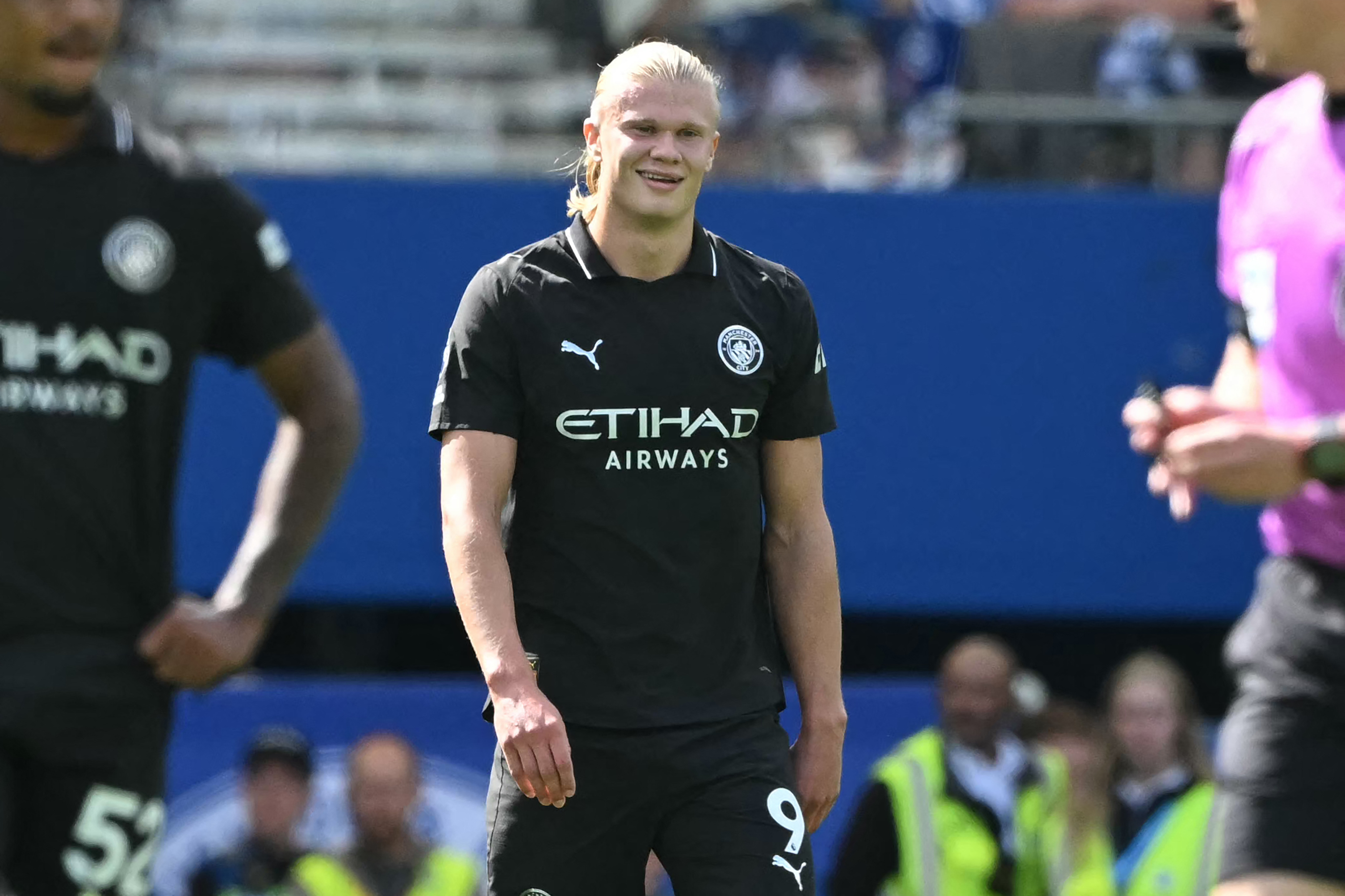 Manchester City's Norwegian striker #09 Erling Haaland smiles after scoring the opening goal of the English Premier League football match between Brighton and Hove Albion and Manchester City at the American Express Community Stadium in Brighton, southern England on August 31, 2025. (Photo by JUSTIN TALLIS / AFP) / RESTRICTED TO EDITORIAL USE. No use with unauthorized audio, video, data, fixture lists, club/league logos or 'live' services. Online in-match use limited to 120 images. An additional 40 images may be used in extra time. No video emulation. Social media in-match use limited to 120 images. An additional 40 images may be used in extra time. No use in betting publications, games or single club/league/player publications. / (Photo by JUSTIN TALLIS/AFP via Getty Images)