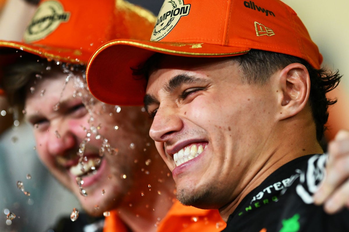 Norris celebrates with his McLaren team (Getty)