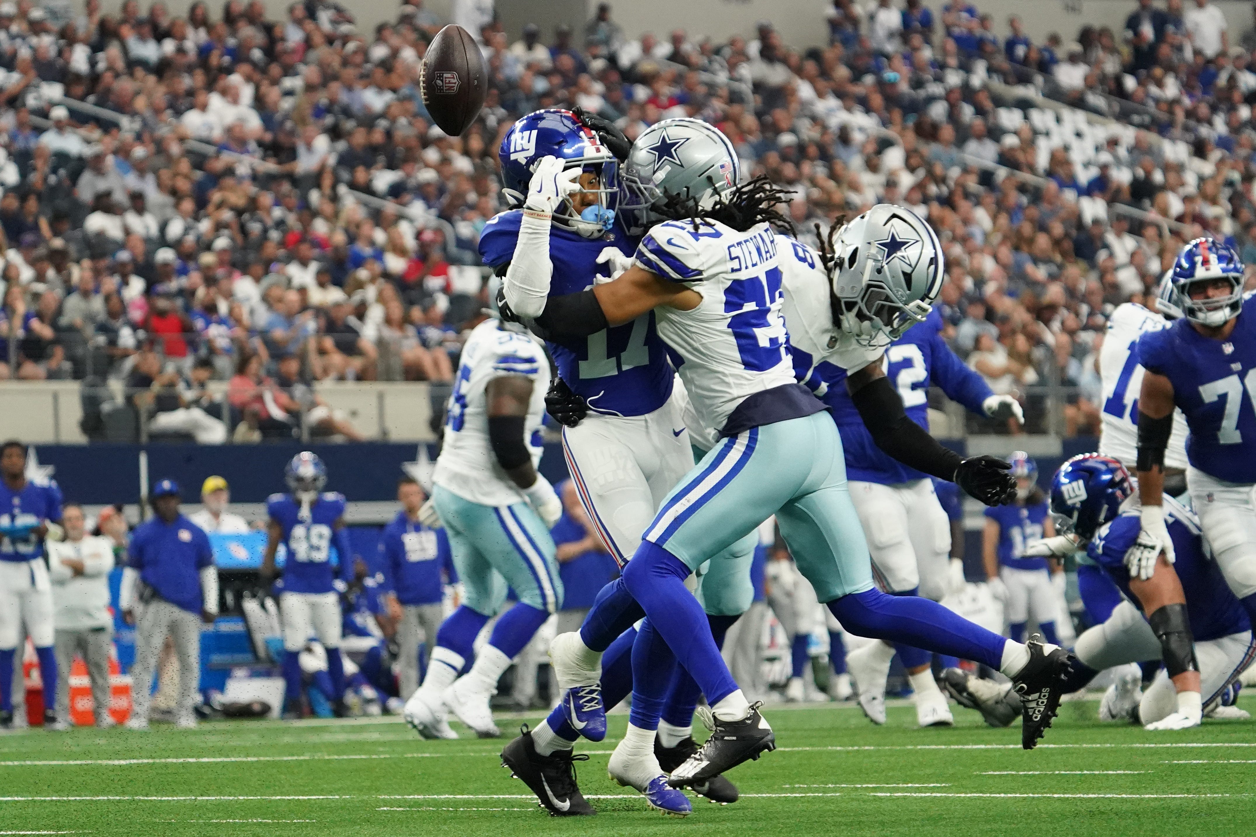 Sep 14, 2025; Arlington, Texas, USA; Dallas Cowboys cornerback Reddy Steward (27) breaks up a pass intended for New York Giants wide receiver Wan'Dale Robinson (17) during the first quarter at AT&T Stadium. Mandatory Credit: Raymond Carlin III-Imagn Images