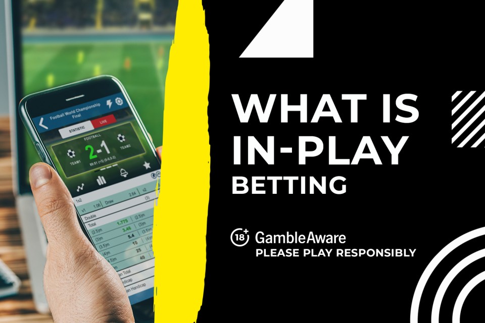Hand holding phone showing in-play betting options for a football match.