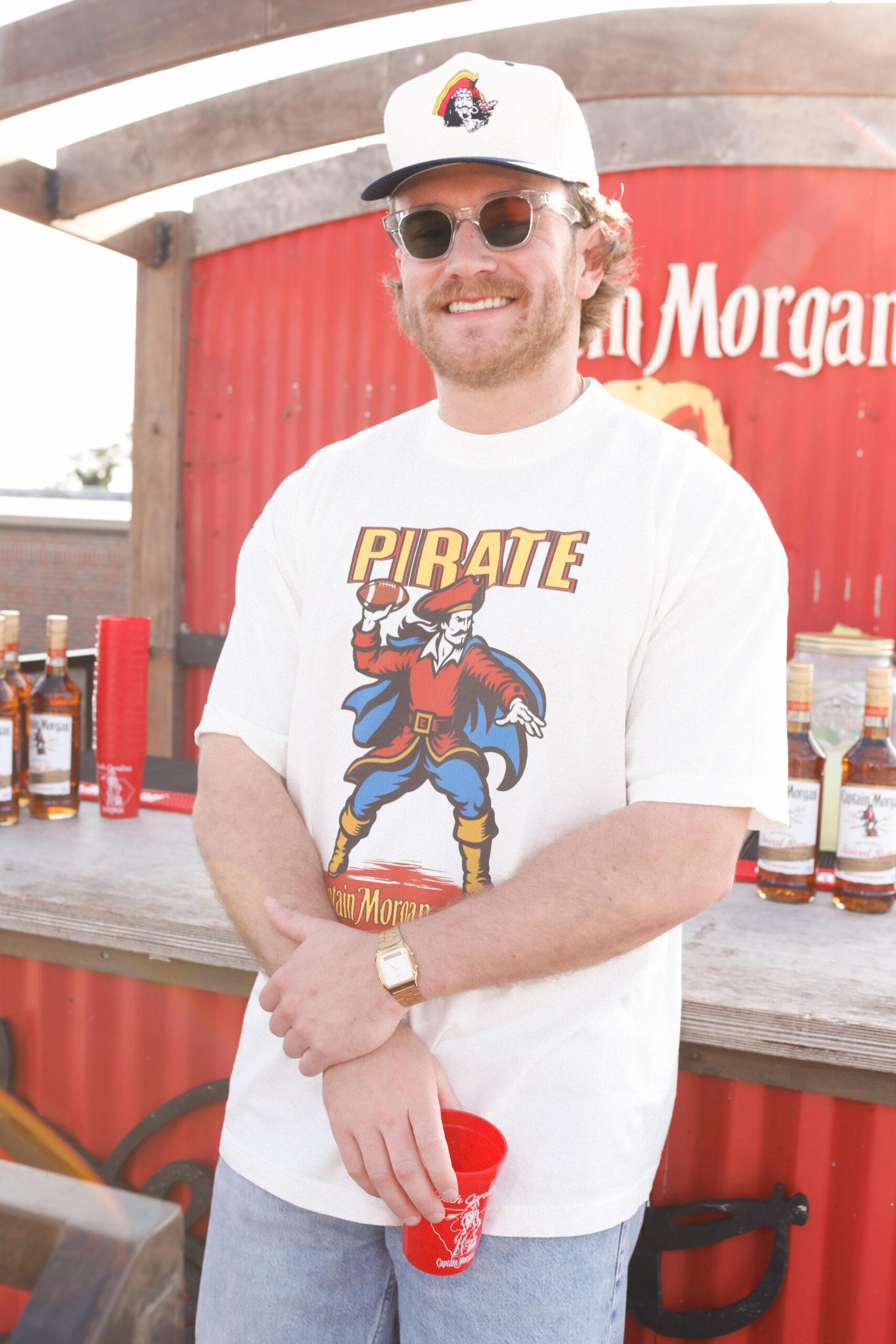 Summer House star West Wilson is teaming up with Captain Morgan to bring The Captain’s Challenge to tailgates across the country and gave fans a first look at the brand’s upcoming collab with Pirate Worldwide.