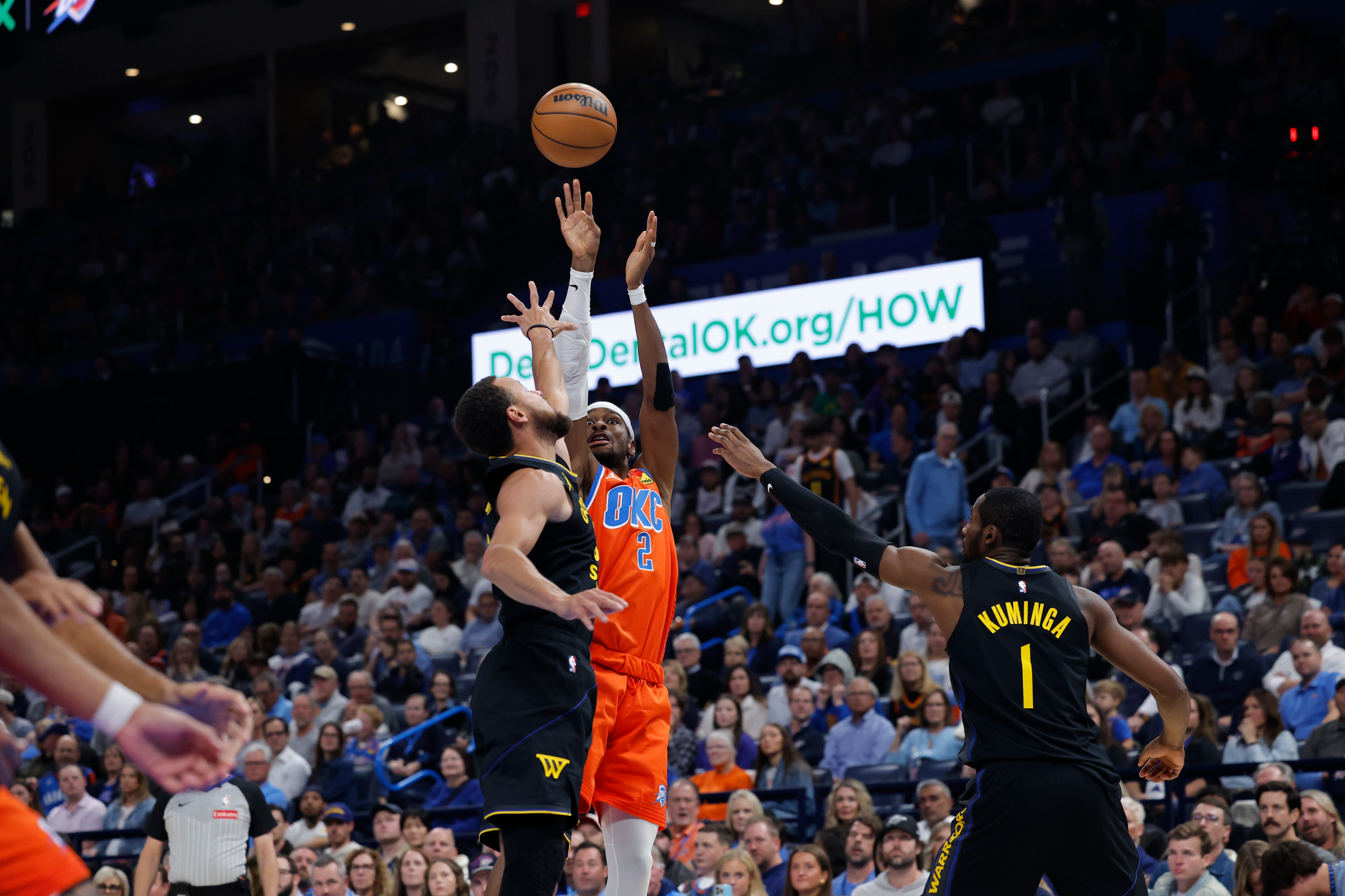 Nov 11, 2025; Oklahoma City, Oklahoma, USA; Oklahoma City Thunder guard Shai Gilgeous-Alexander (2) shoots over Golden State Warriors guard Stephen Curry (30) during the second quarter at Paycom Center. Mandatory Credit: Alonzo Adams-Imagn Images