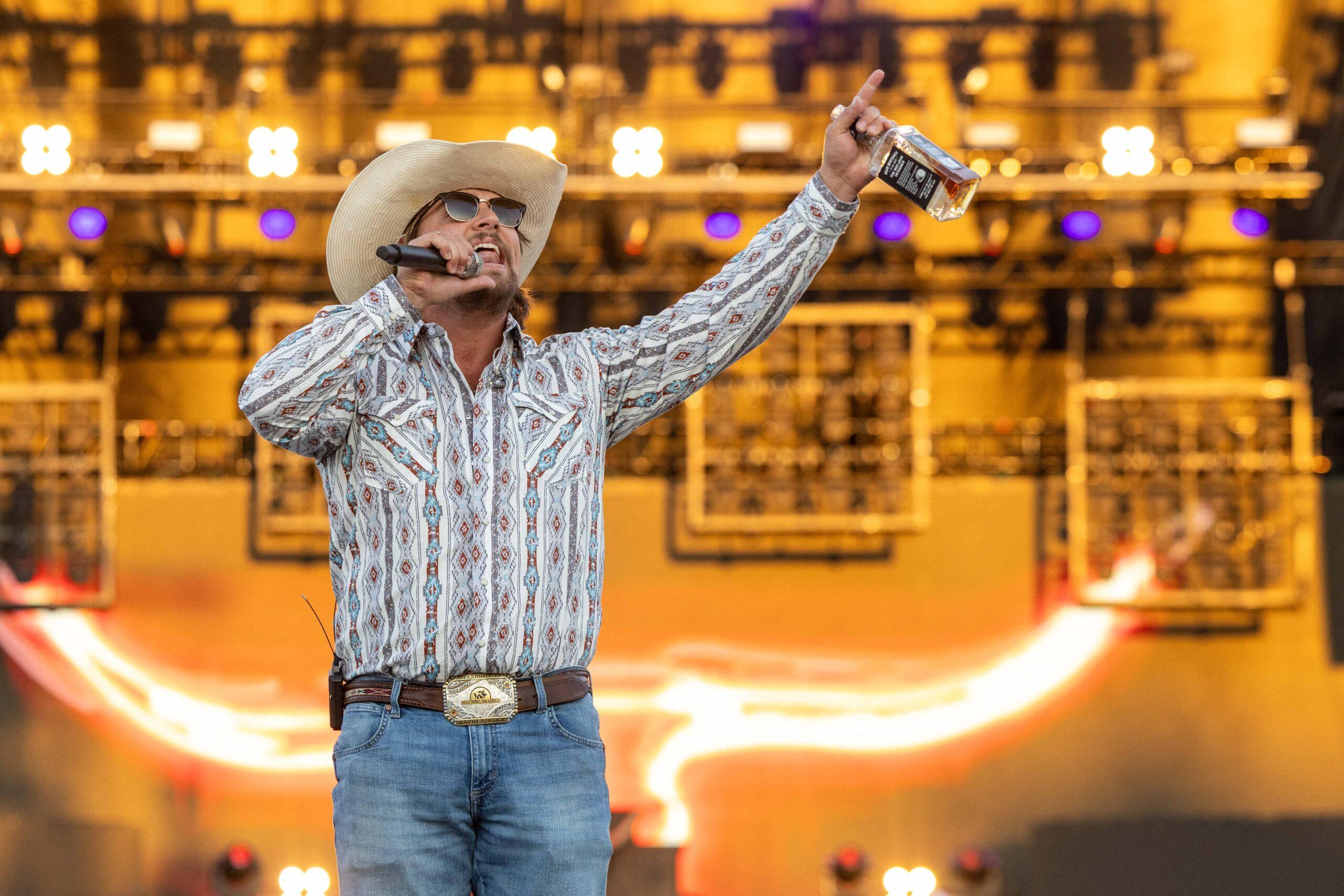 Gavin Adcock singing on stage.