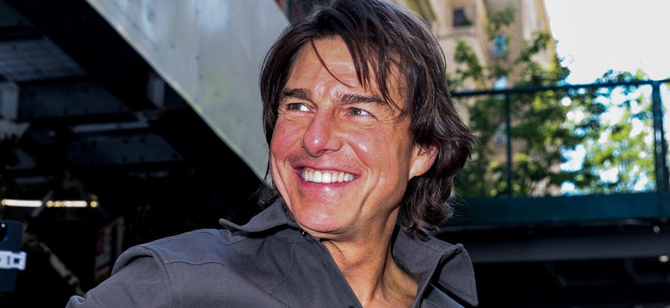 Tom Cruise is seen waving to his fans outside his car as he leaves his hotel this afternoon in New York City